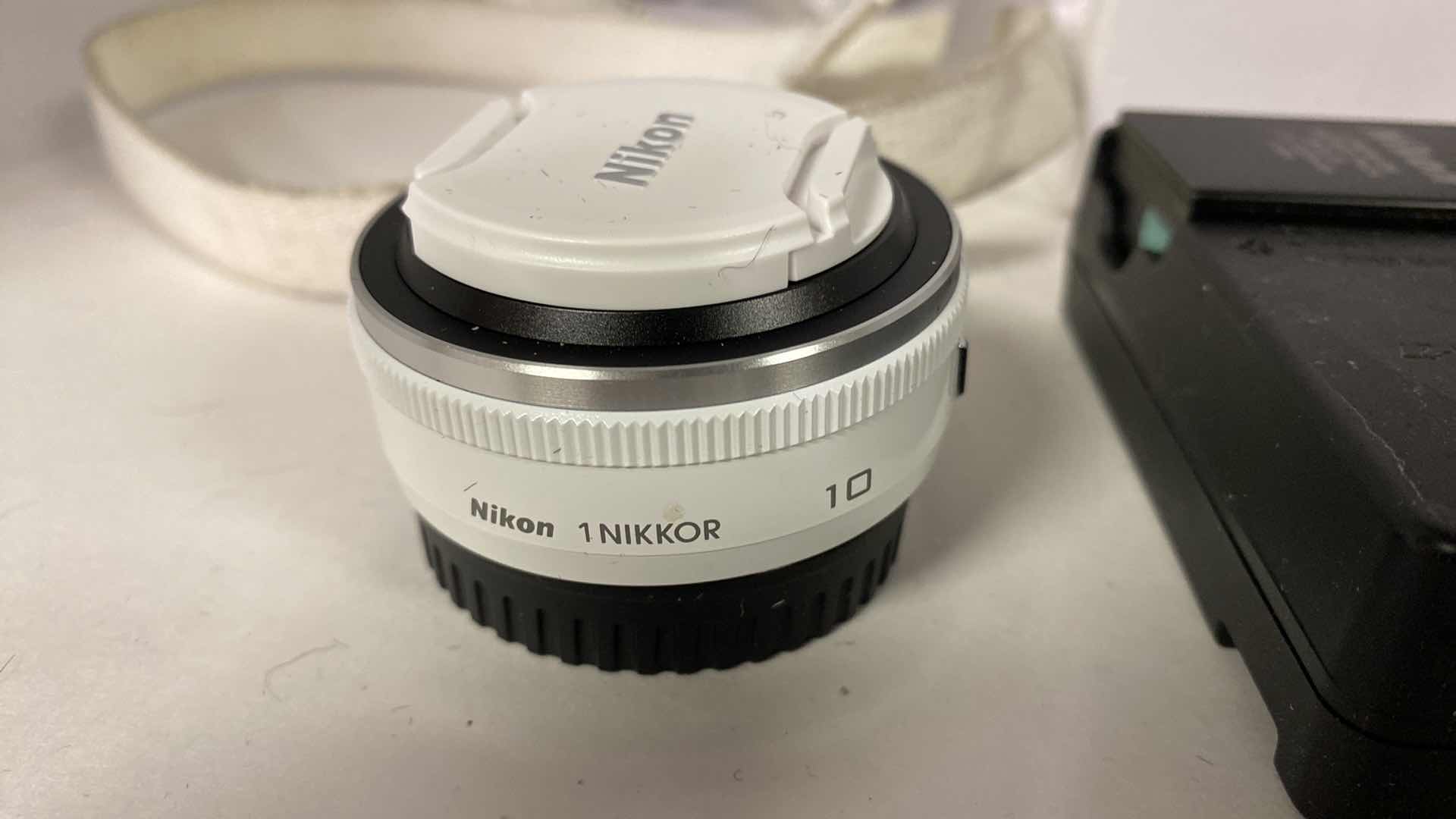 Photo 1 of NIKON 1 CAMERA WITH CASE, MACRO  LENS, 2 CHARGERS BOOKLETS