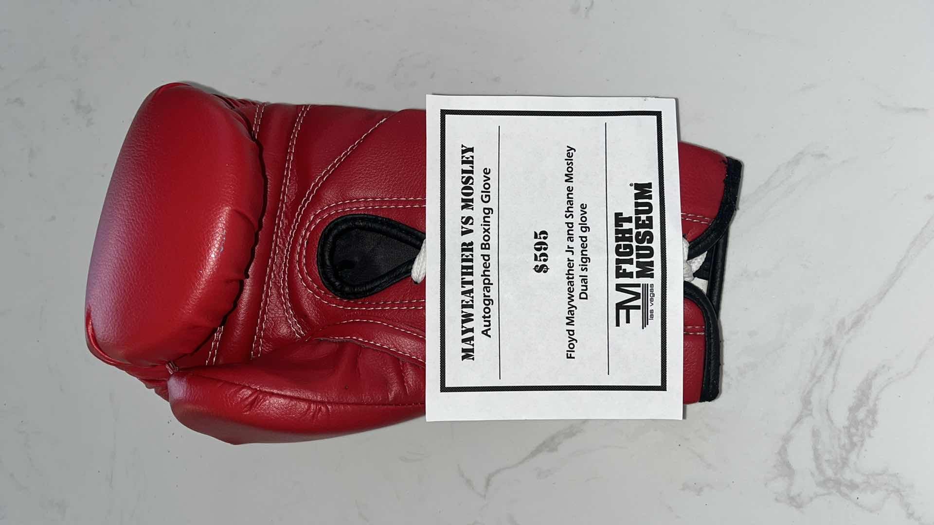Photo 1 of RED TITLE BOXING GLOVE SIGNED BY “SUGAR” SHANE MOSLEY AND FLOYD MAYWEATHER Jr.