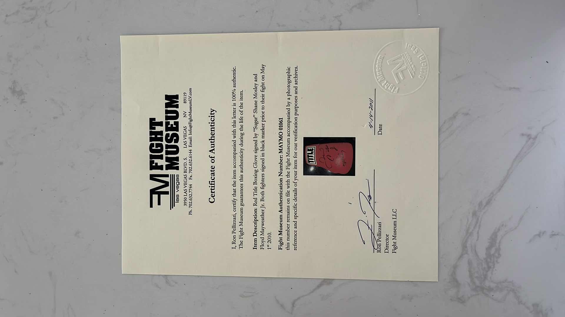 Photo 1 of RED TITLE BOXING GLOVE SIGNED BY “SUGAR” SHANE MOSLEY AND FLOYD MAYWEATHER Jr.