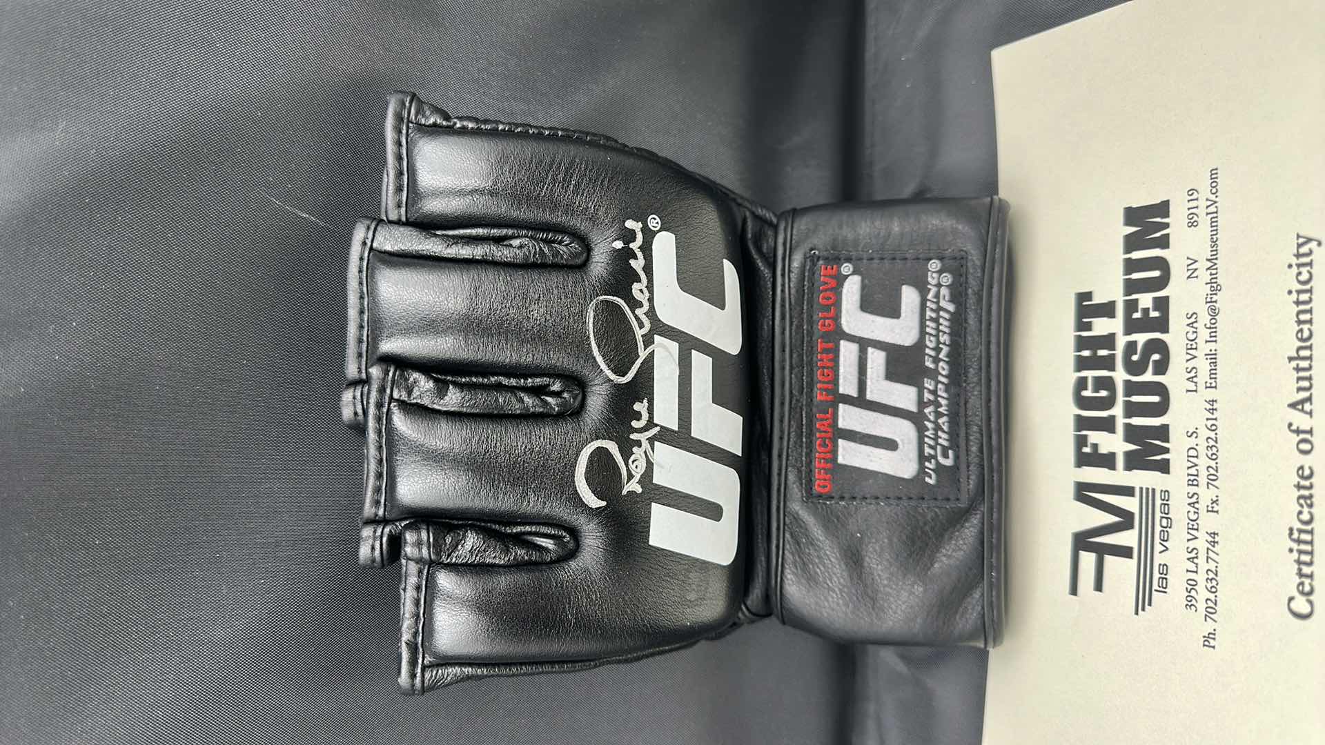 Photo 1 of ROYCE GRACIE SIGNED UFC GLOVE W COA