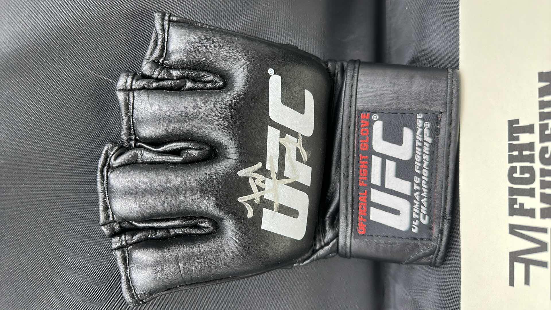 Photo 1 of FRANK TRIGG SIGNED UFC GLOVE W COA