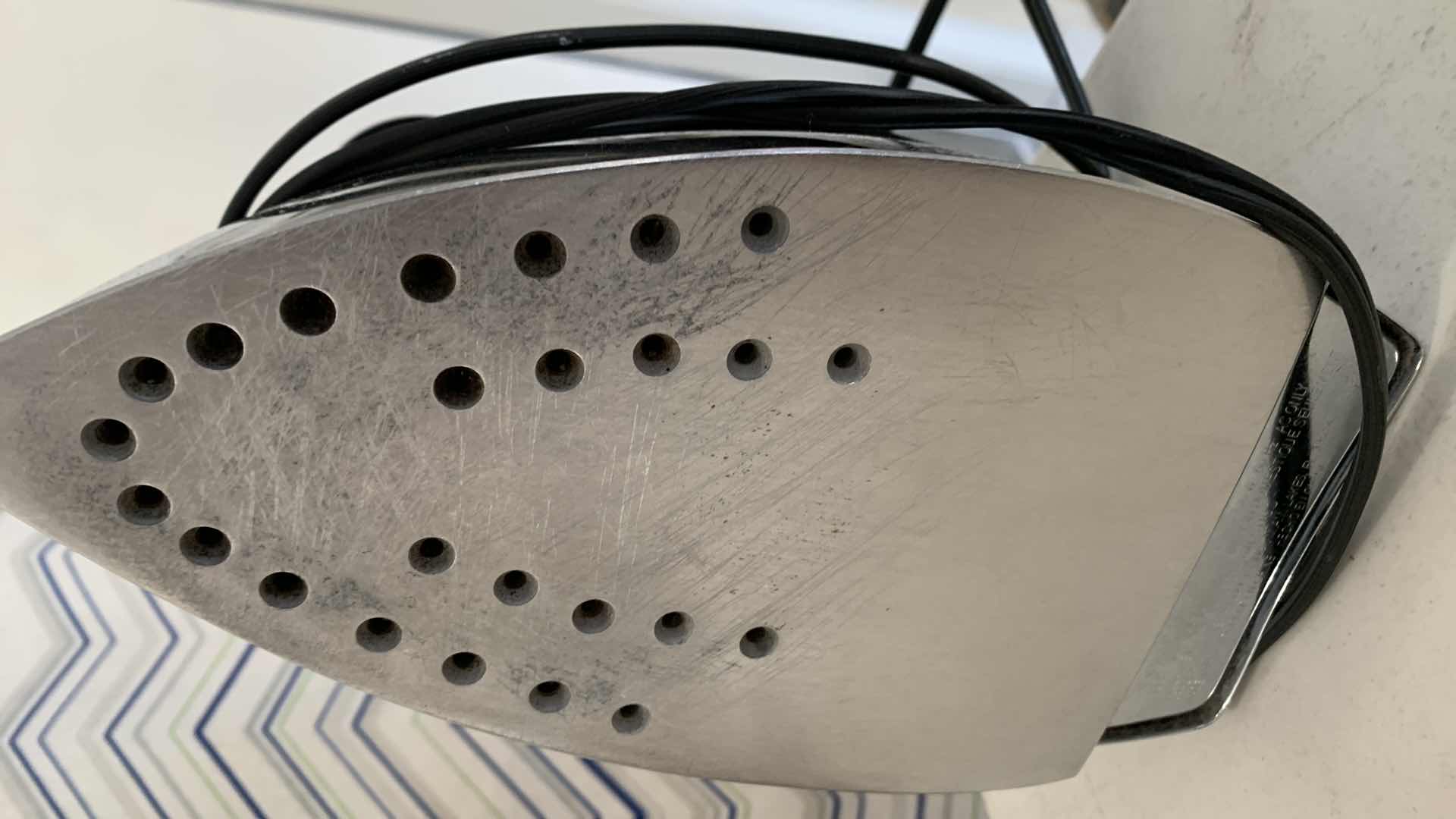 Photo 1 of IRONING BOARD AND BLACK AND DECKER IRON