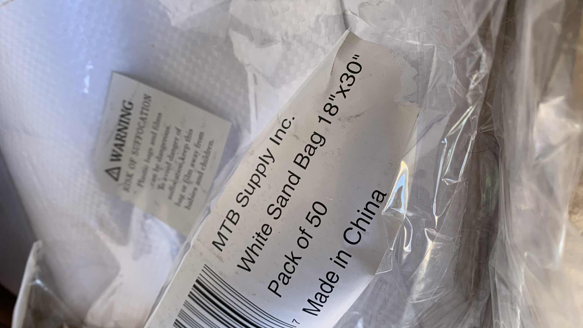 Photo 1 of PACK OF FIFTY SAND BAGS WHITE 18” X 30”