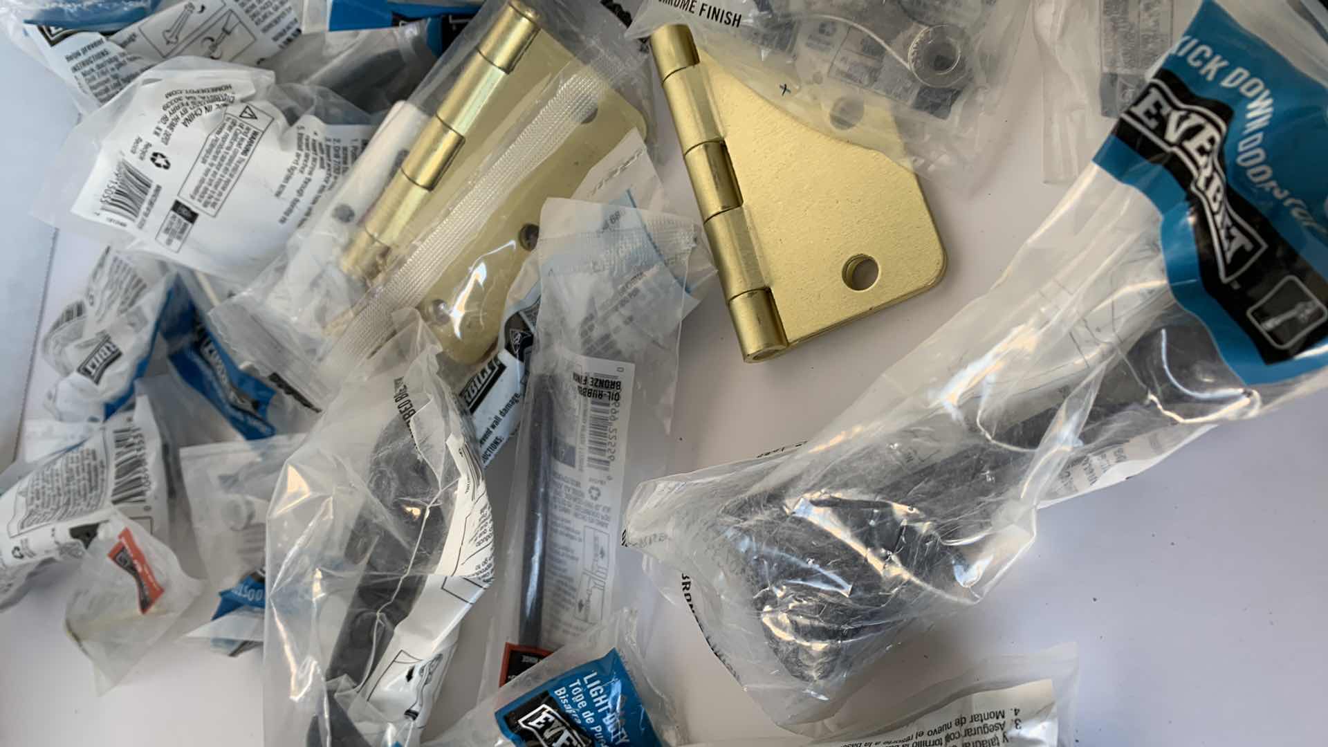 Photo 3 of ASSORTED HINGES, DOOR STOPS, HOME HARDWARE