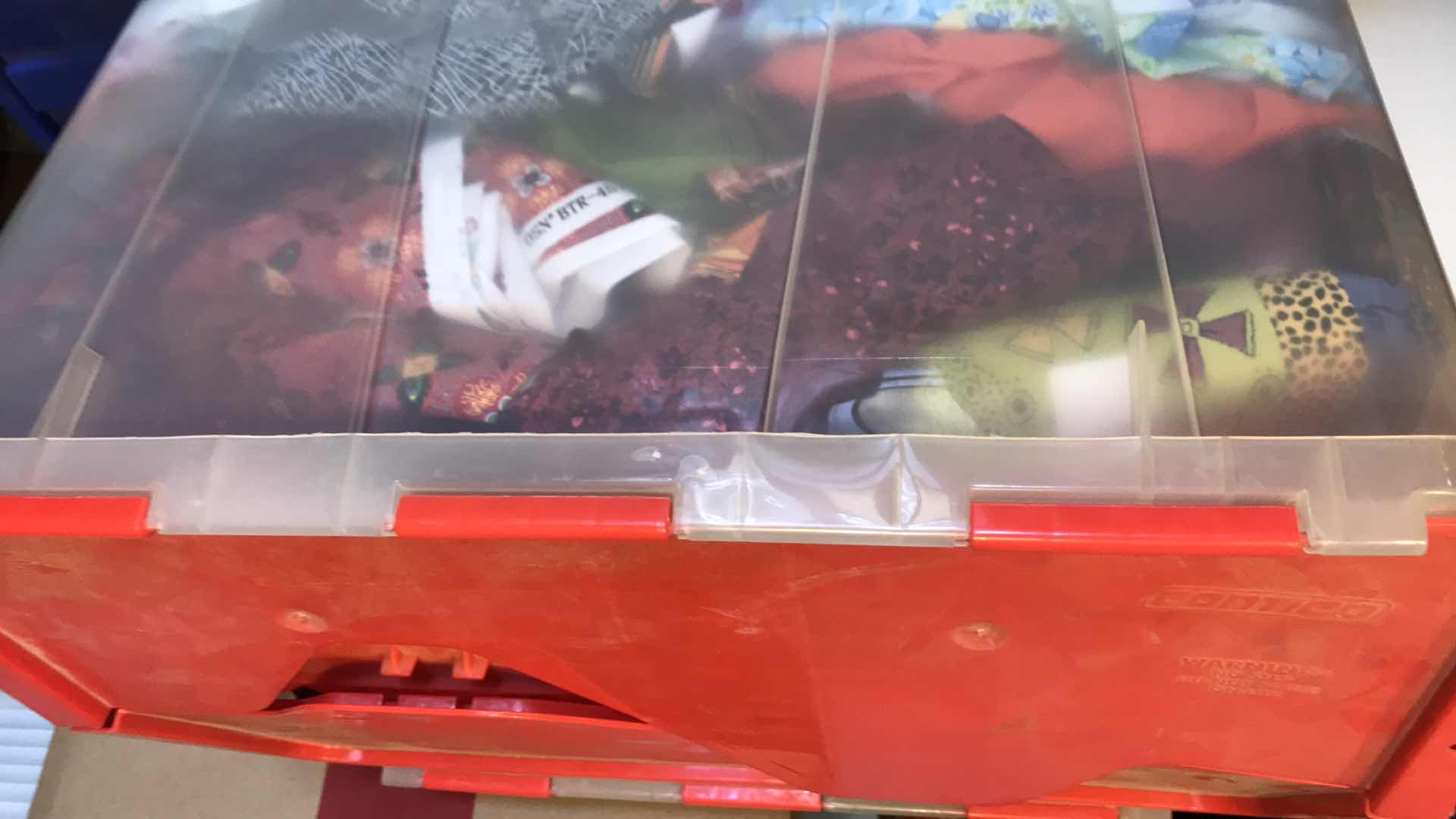 Photo 1 of LARGE BIN OF ASSORTED FABRIC REMNANTS FOR QUILTING