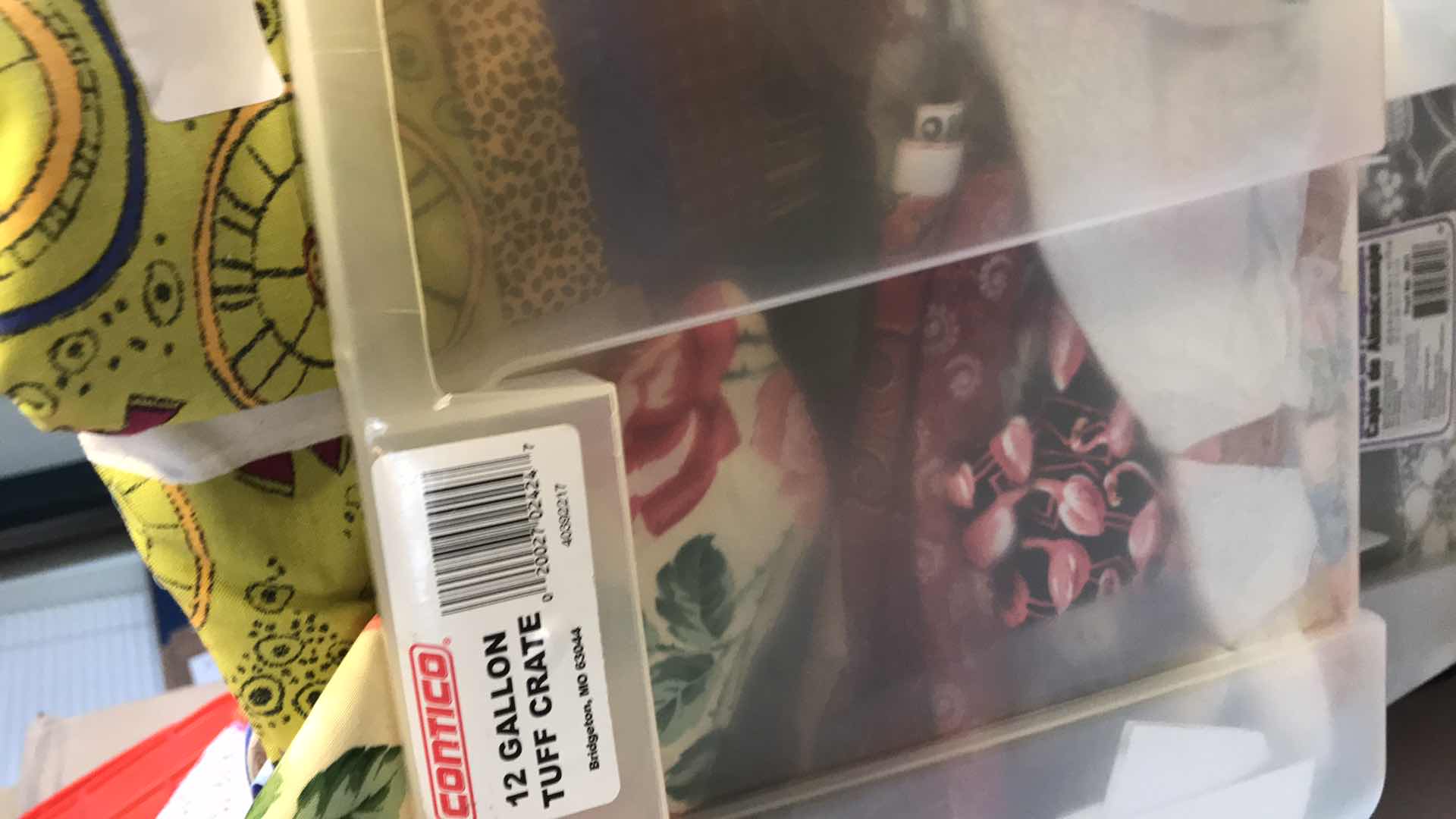 Photo 1 of LARGE BIN OF ASSORTED FABRIC REMNANTS FOR QUILTING