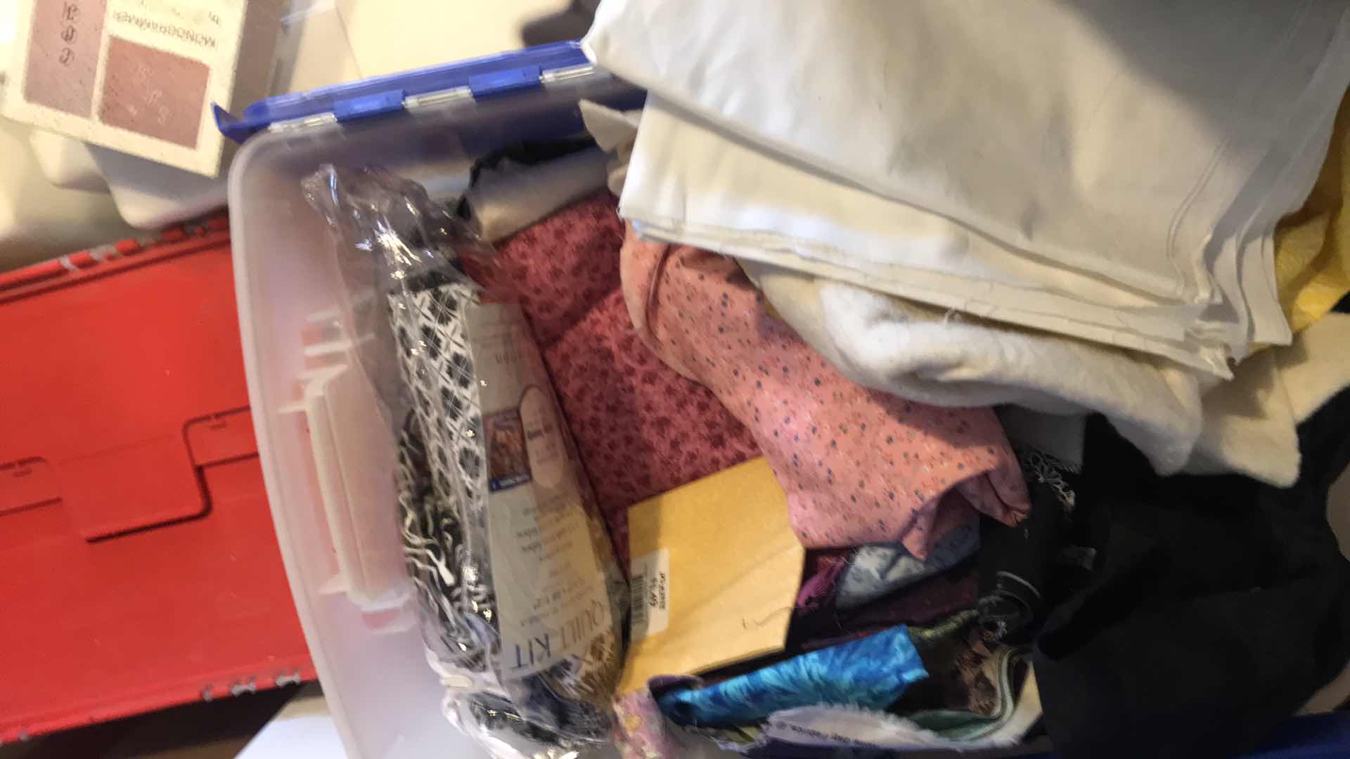 Photo 1 of LARGE BIN OF FABRIC REMNANTS FOR QUILTING