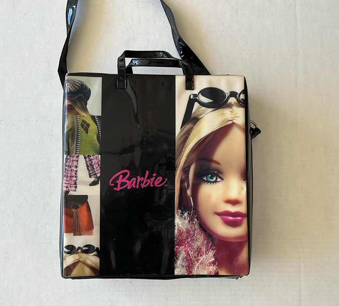 Photo 1 of BARBIE BAG WITH CLOTHING ITEMS AND ACCESSORIES 11” X 12”