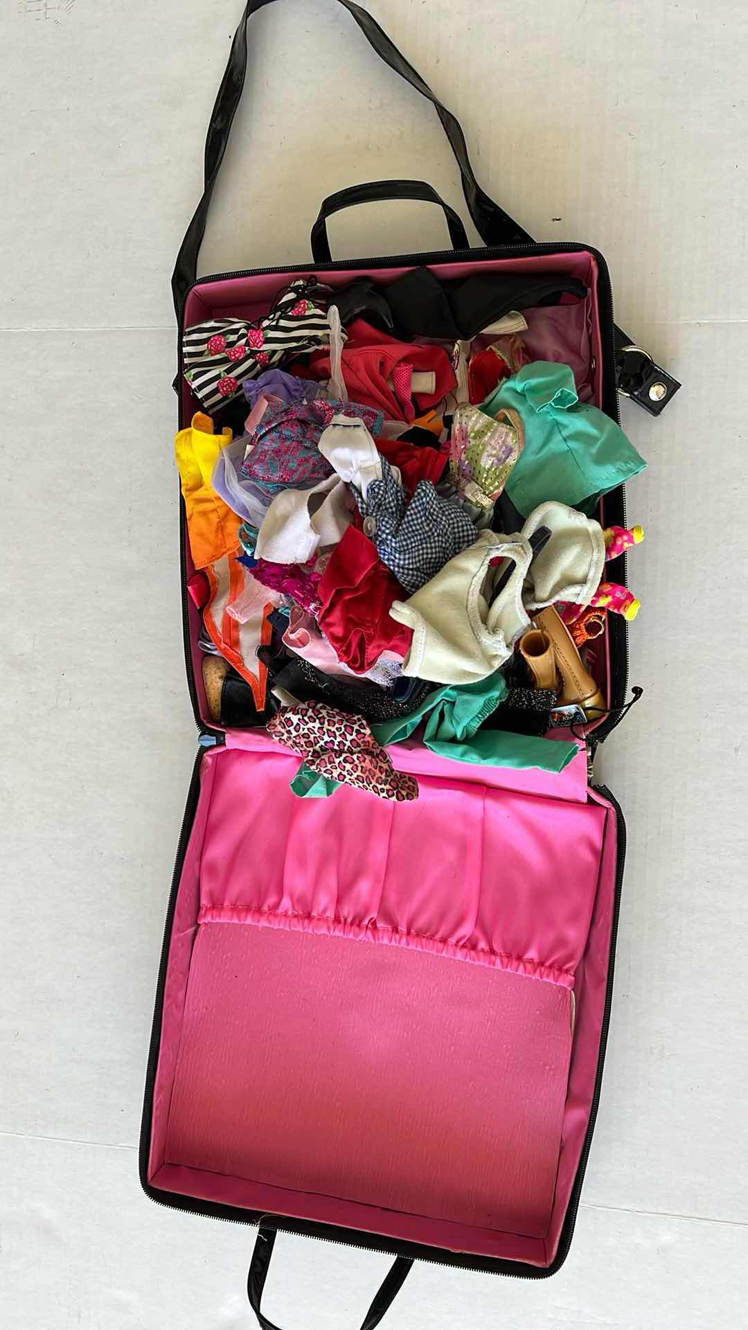 Photo 1 of BARBIE BAG WITH CLOTHING ITEMS AND ACCESSORIES 11” X 12”