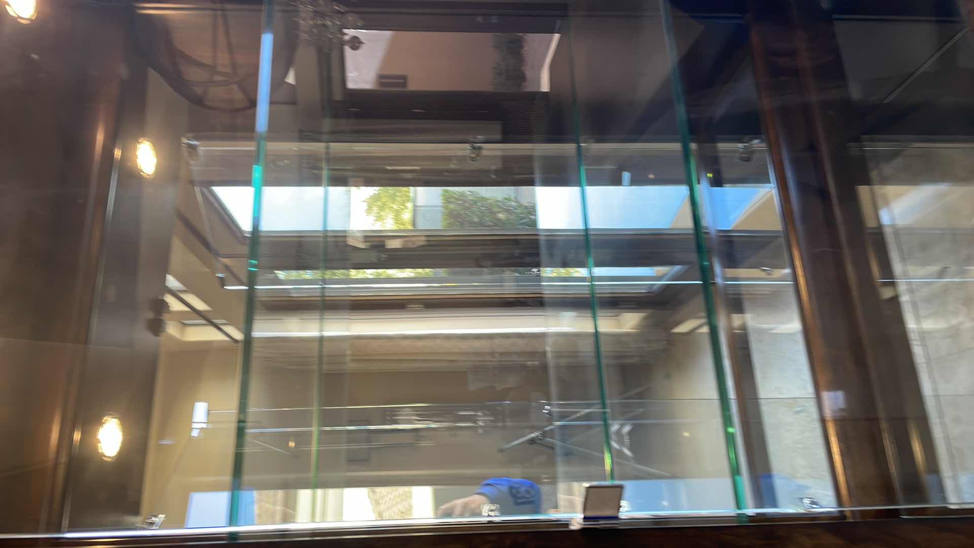 Photo 1 of ROBB & STUCKY HINGE TOUCH ACTIVATED LIGHTED CURIO WITH 4 GLASS SHELVES AND MIRRORED BACK 38" X 18" H84"