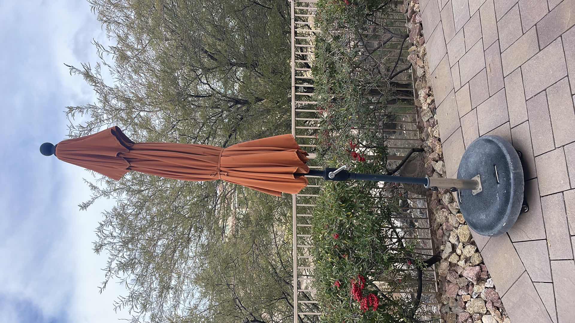 Photo 1 of 9’ TREASURE GARDEN UMBRELLA WITH ROLLING WEIGHTED STAND