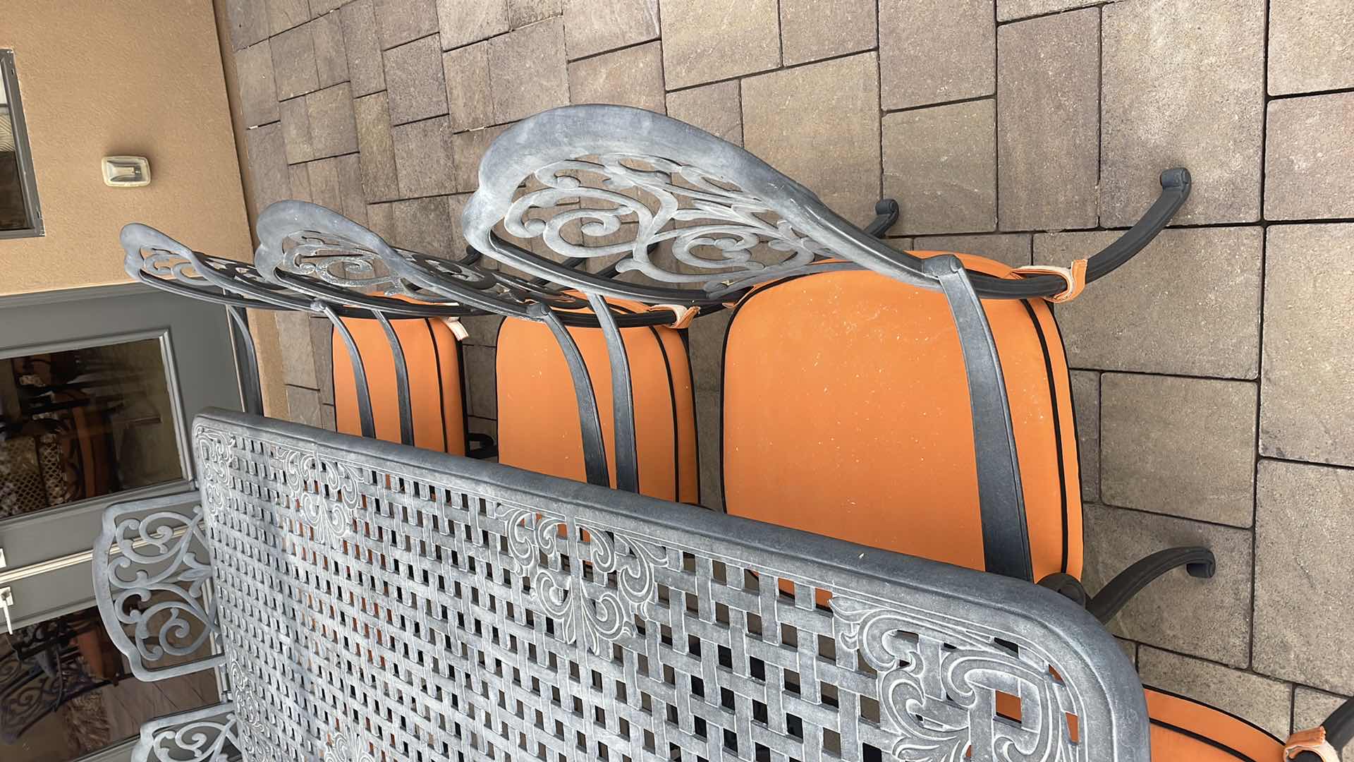 Photo 1 of LUXURY PATIO FURNITURE SET - TABLE 64” X 90” WITH 10 CHAIRS ORANGE CUSHIONS WITH BLACK WELTING