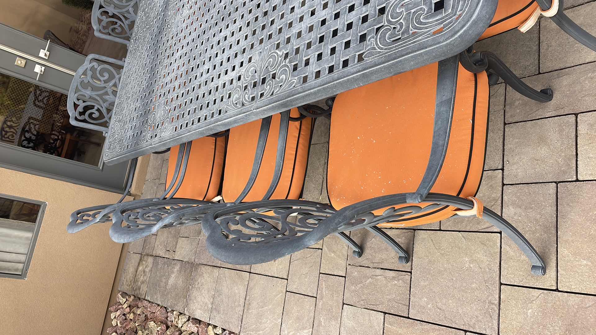 Photo 1 of LUXURY PATIO FURNITURE SET - TABLE 64” X 90” WITH 10 CHAIRS ORANGE CUSHIONS WITH BLACK WELTING