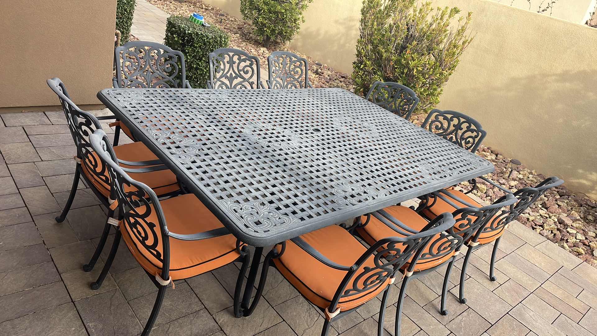 Photo 1 of LUXURY PATIO FURNITURE SET - TABLE 64” X 90” WITH 10 CHAIRS ORANGE CUSHIONS WITH BLACK WELTING