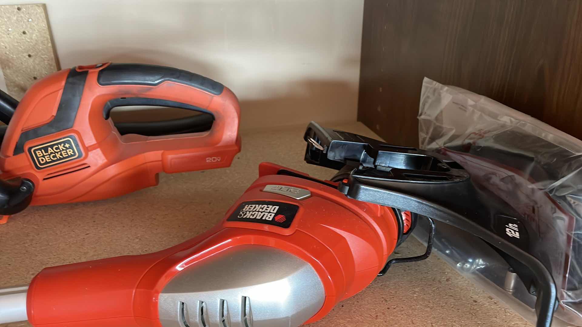 Photo 1 of BLACK & DECKER, 20 V BLOWER HEDGER AND WEEDEATER THREE BATTERIES, THREE CHARGERS