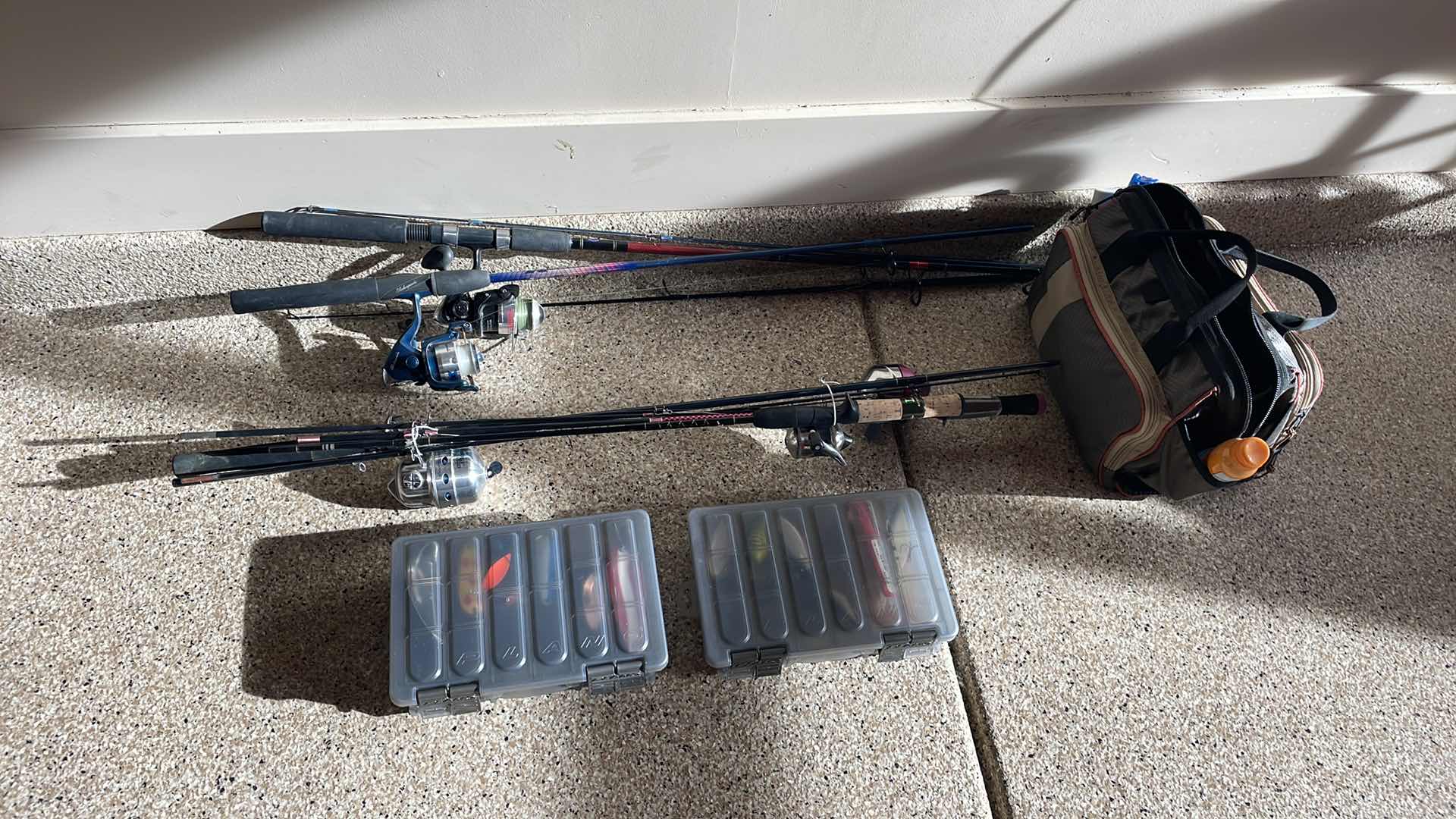 Photo 1 of FISHING POLES AND TACKLE BOXES AND BAG