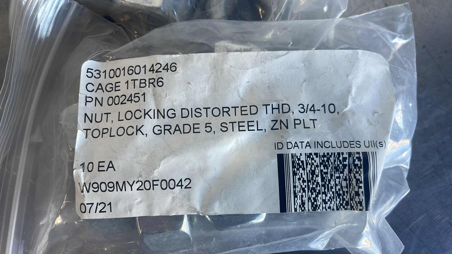 Photo 1 of NUT, LOCKING DISTORTED THD, 3/L TOPLOCK, GRADE 5, STEEL, ZN PL (90)