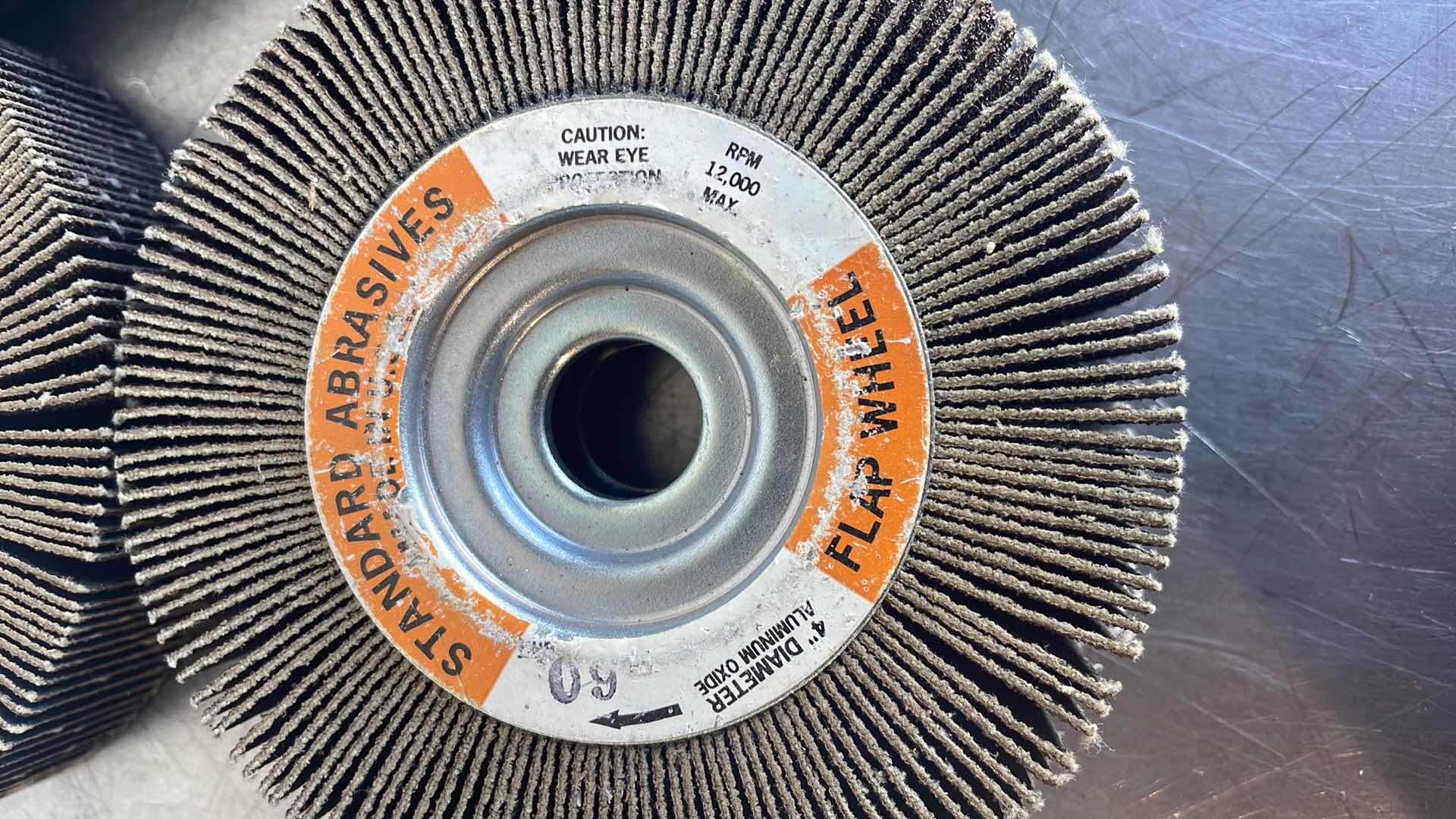 Photo 1 of STANDARD ABRASIVES 4” ALUMINUM OXIDE FLAP WHEEL (4)