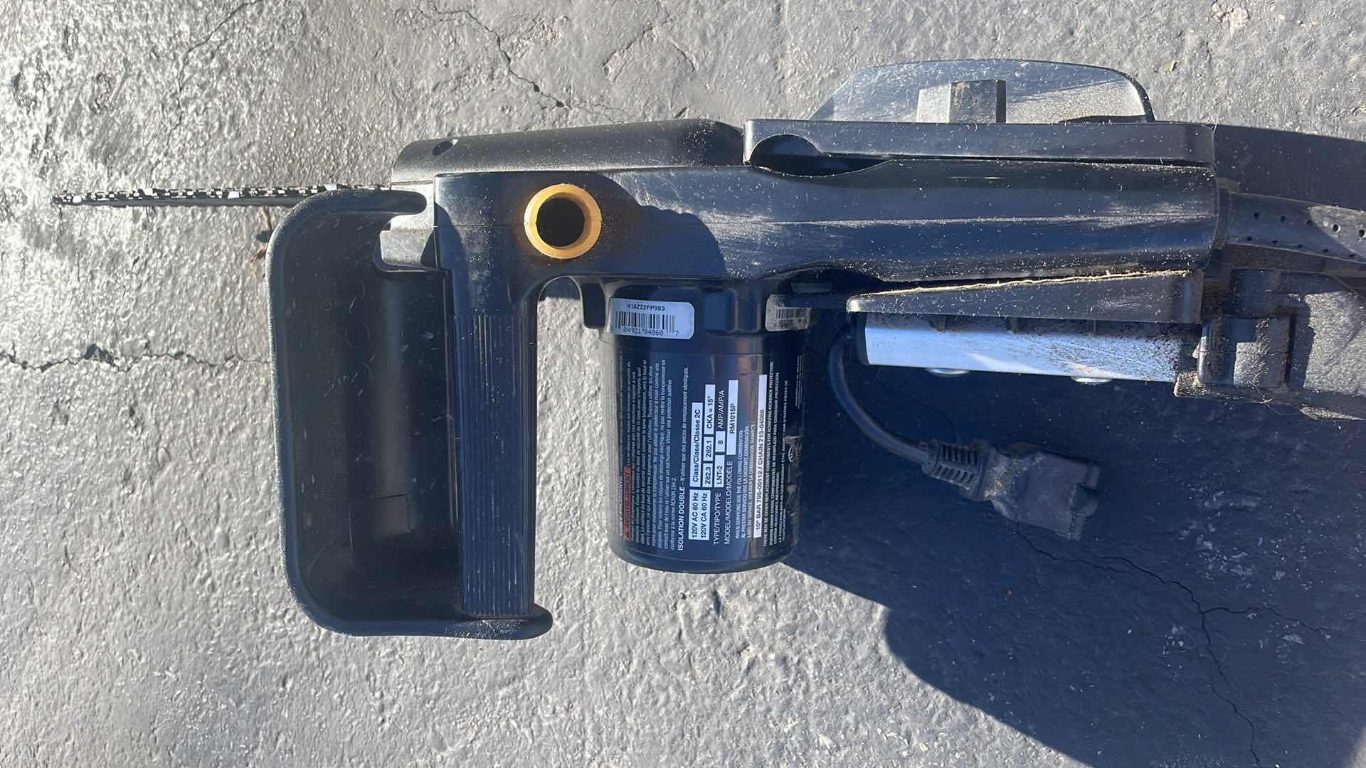 Photo 1 of REMINGTON ELECTRIC POLE SAW - 10" BAR, 8 AMP MOTOR, MODEL# RM1015P BRANCH WIZARD