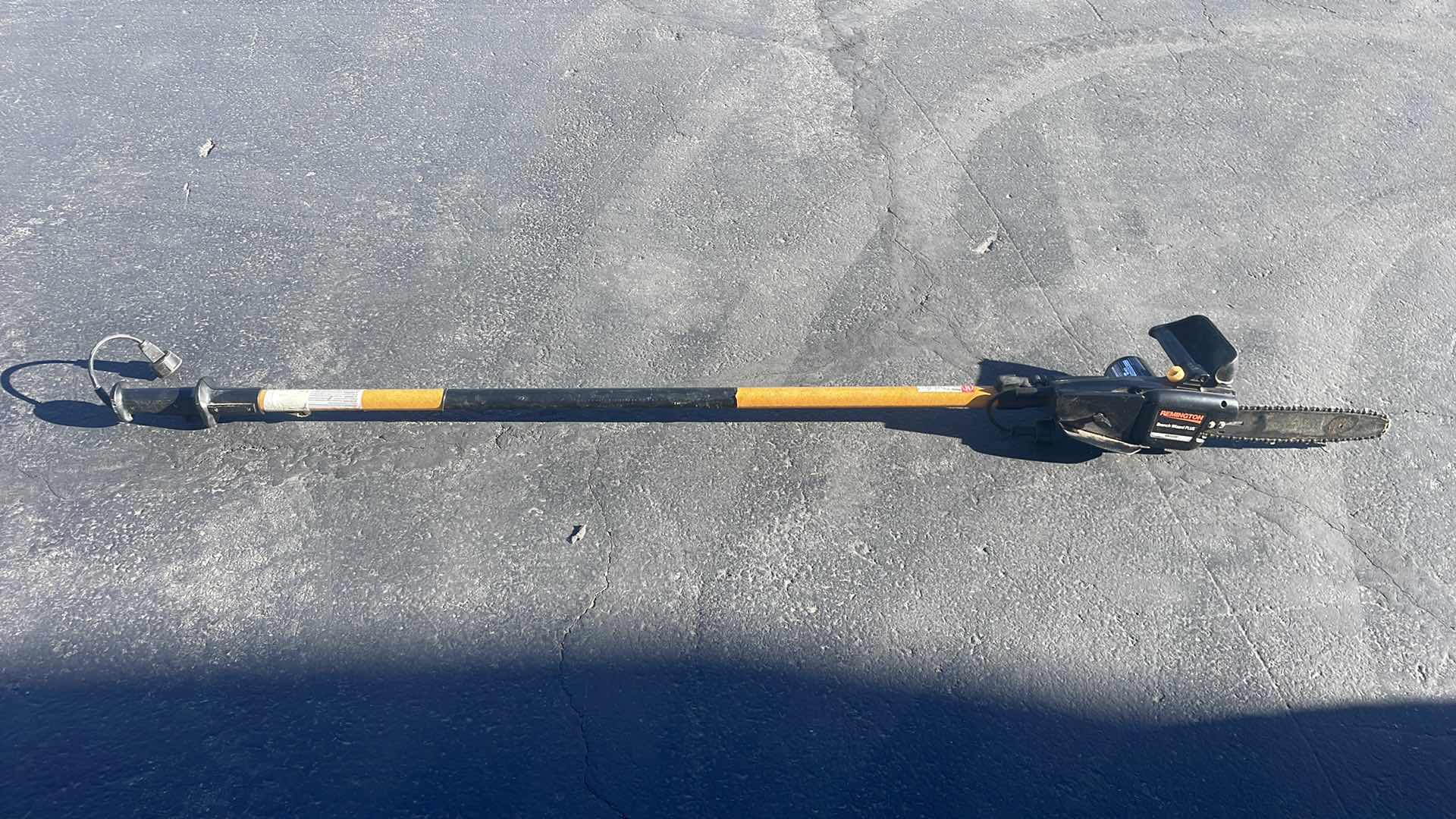 Photo 1 of REMINGTON ELECTRIC POLE SAW - 10" BAR, 8 AMP MOTOR, MODEL# RM1015P BRANCH WIZARD
