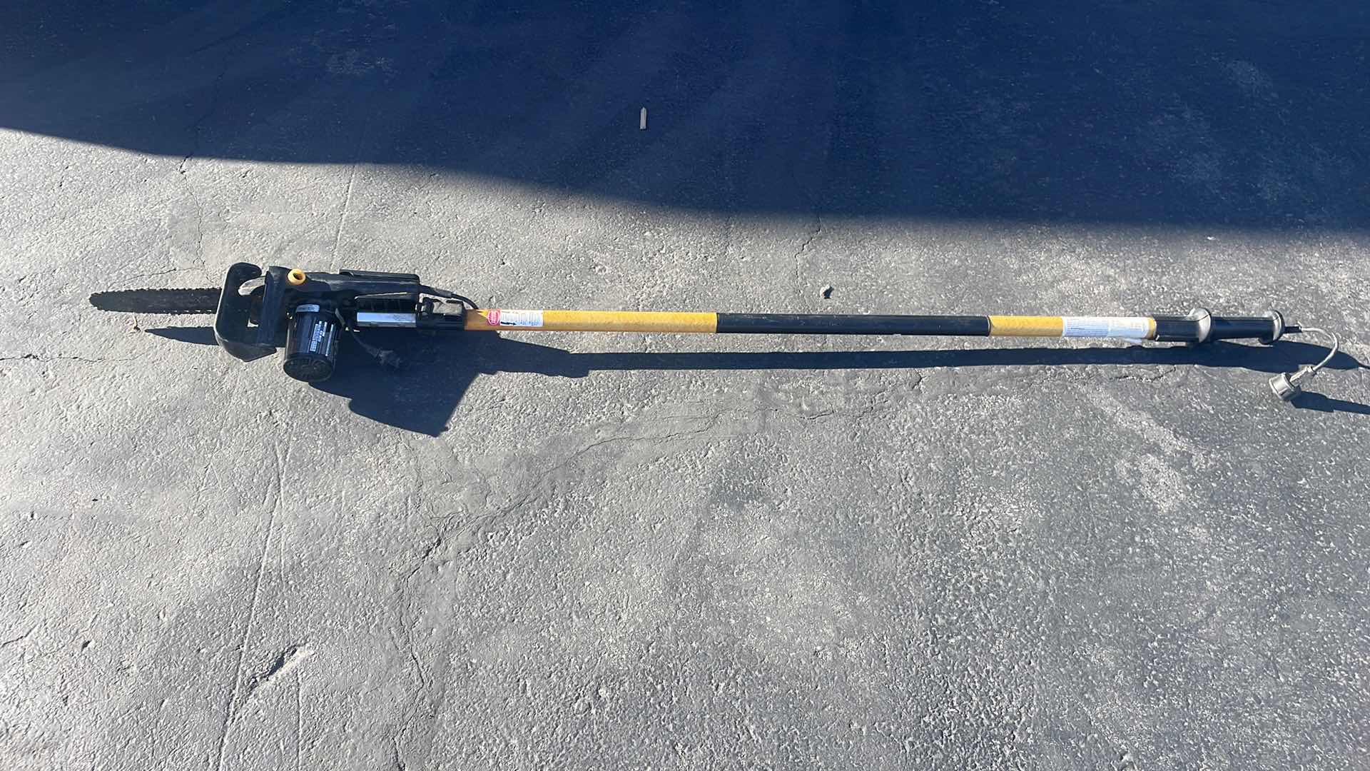 Photo 1 of REMINGTON ELECTRIC POLE SAW - 10" BAR, 8 AMP MOTOR, MODEL# RM1015P BRANCH WIZARD