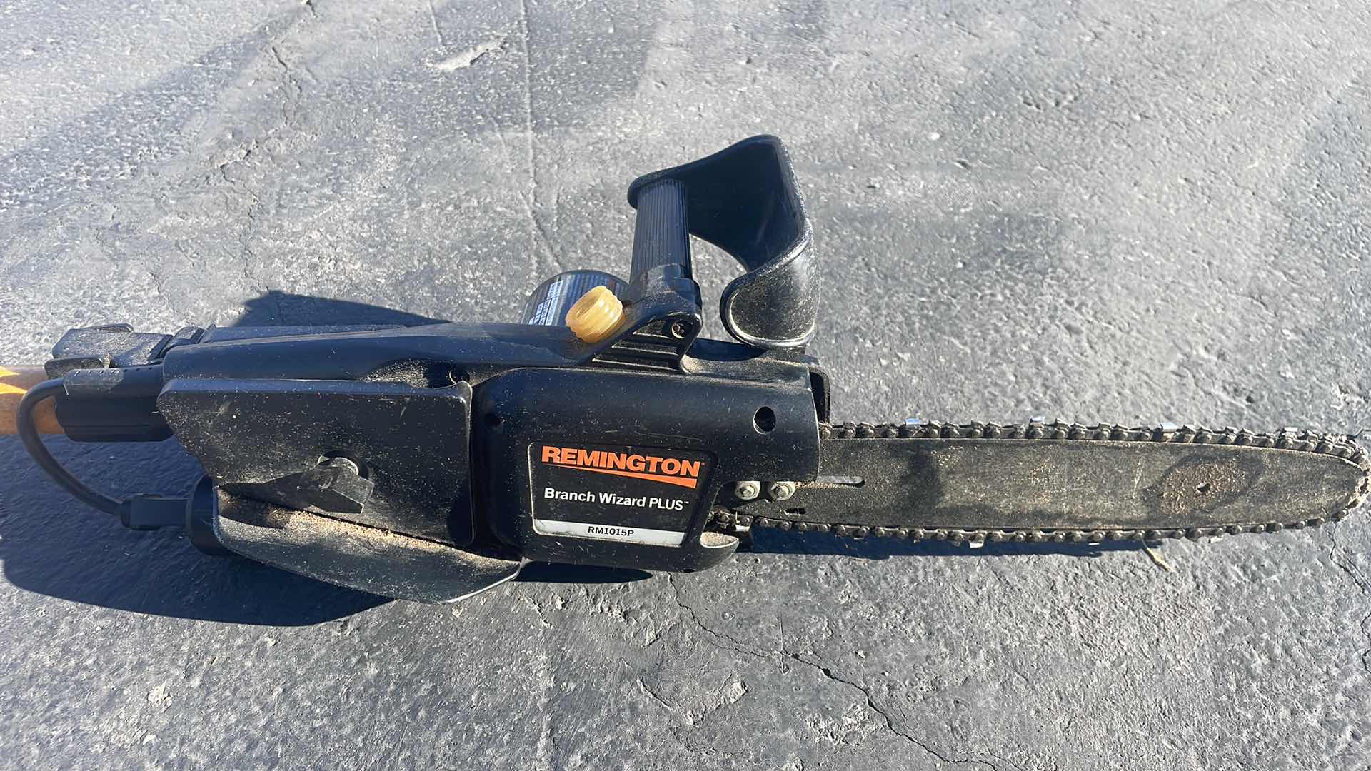 Photo 1 of REMINGTON ELECTRIC POLE SAW - 10" BAR, 8 AMP MOTOR, MODEL# RM1015P BRANCH WIZARD