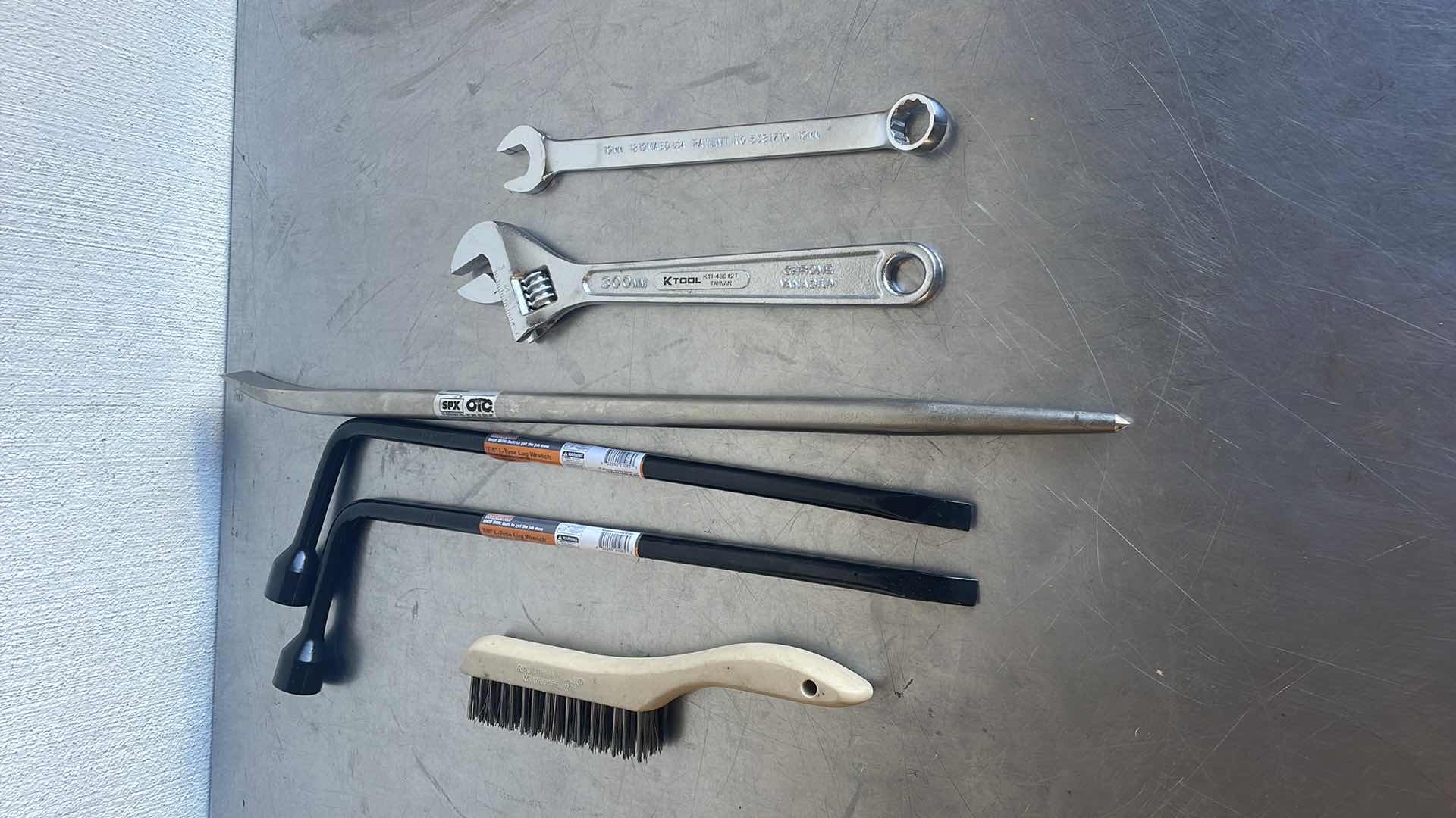 Photo 1 of SPX OTC 24” JIMMY BAR, 12” ADJUSTABLE WRENCH, 19MM OPEN END COMBO WRENCH, 2 7/8” L-TYPE LUG WRENCHES, WIRE BRUSH