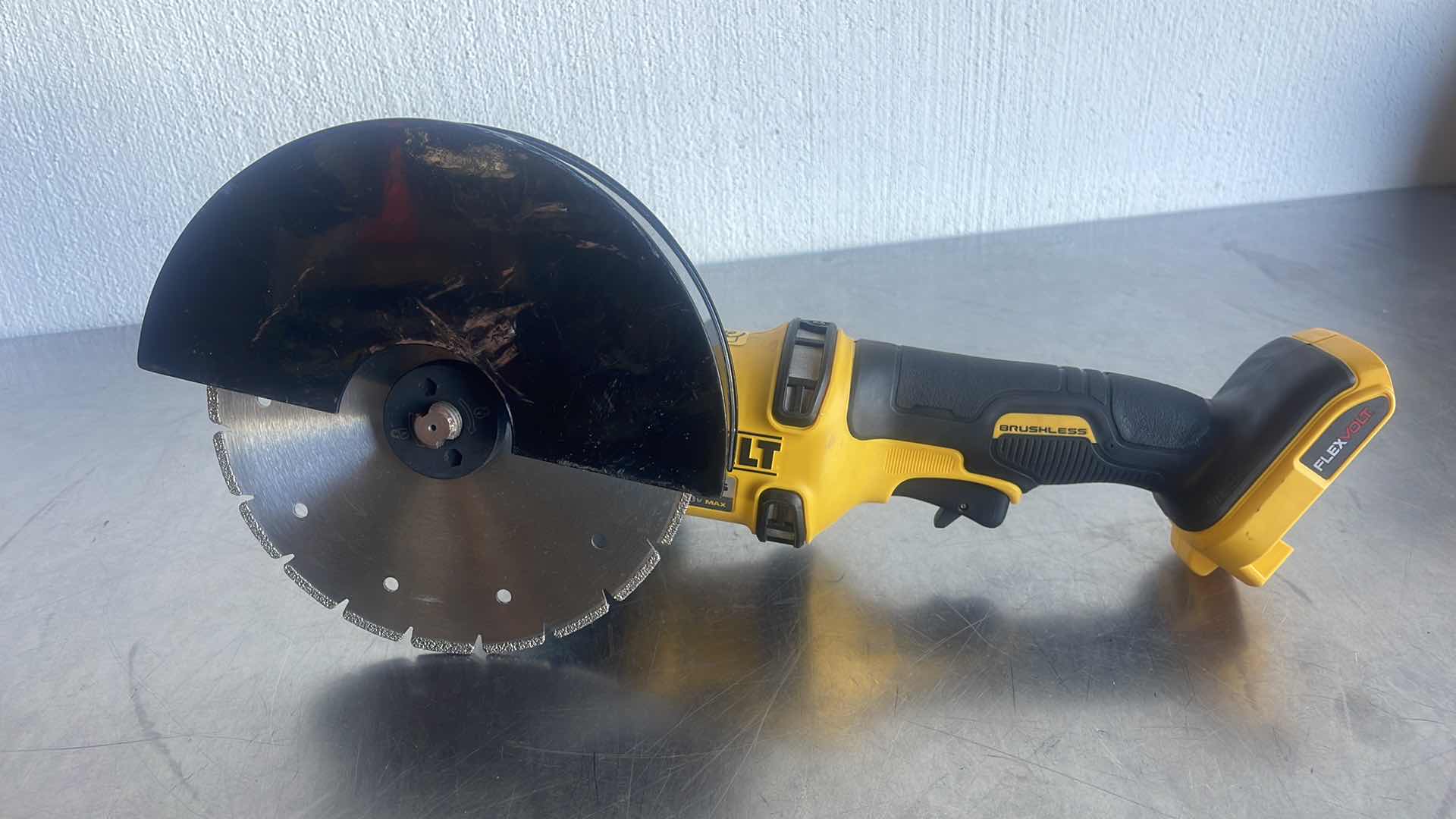 Photo 1 of DEWALT FLEXVOLT 60V MAX DCG414 GRINDER WITH BROCO 7” DIAMOND BLADE