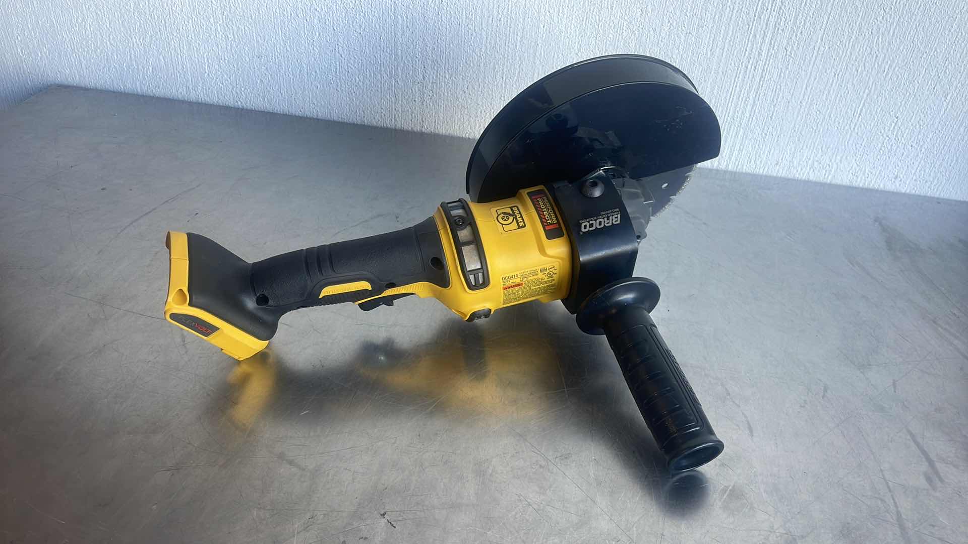 Photo 1 of DEWALT FLEXVOLT 60V MAX DCG414 GRINDER WITH BROCO 7” DIAMOND BLADE