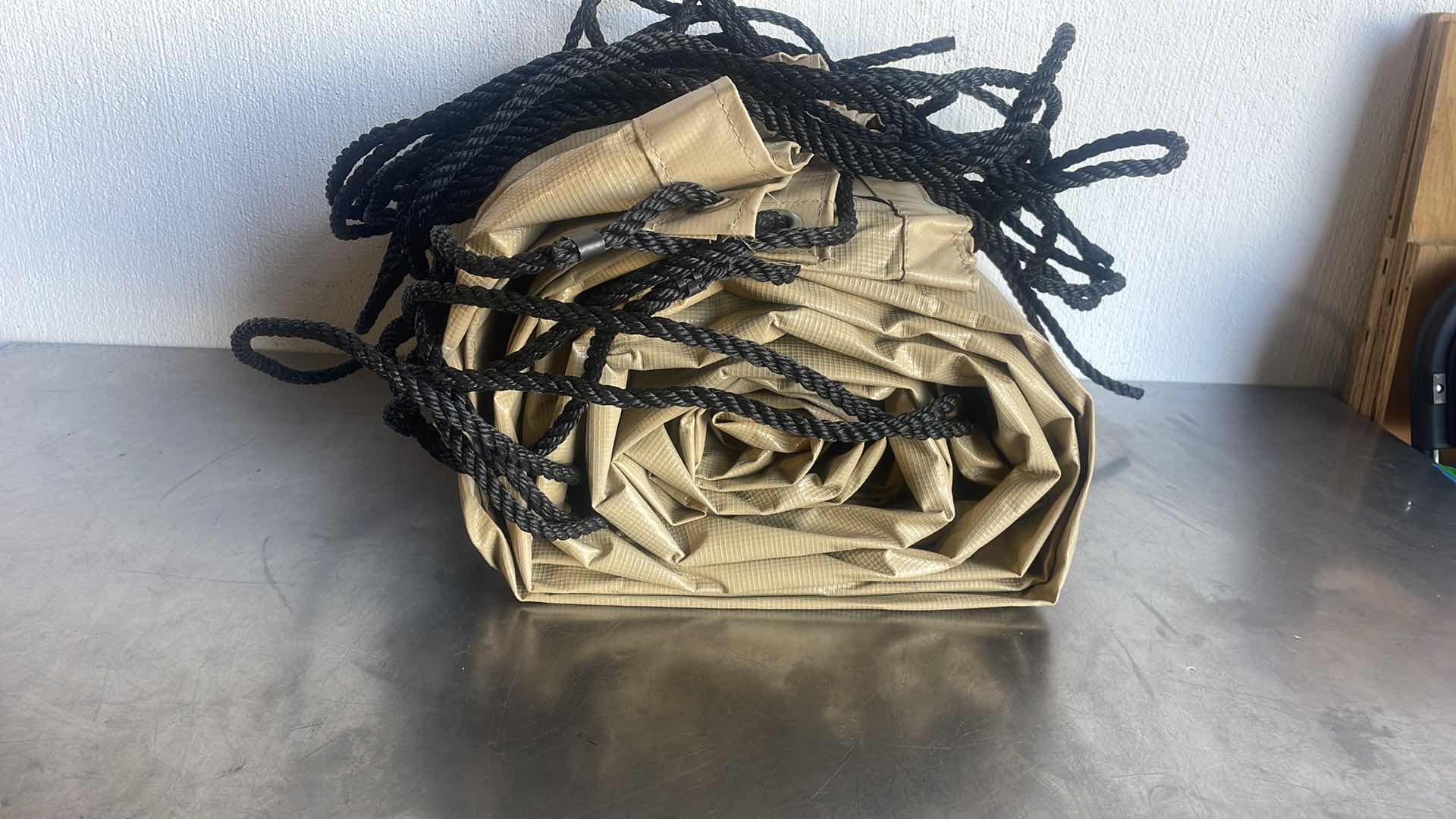 Photo 1 of LARGE TAN TARP ROUGHLY 16’ x 8’