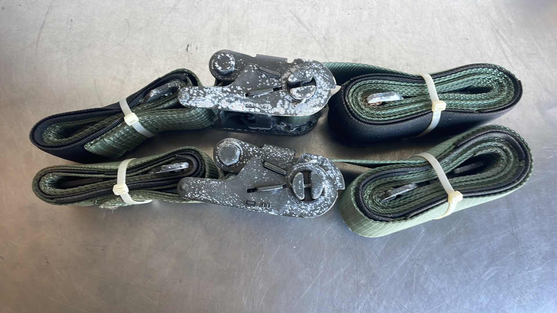 Photo 1 of HEAVYDUTY 3” RATCHETING STRAPS SLIGHT WATER DAMAGE