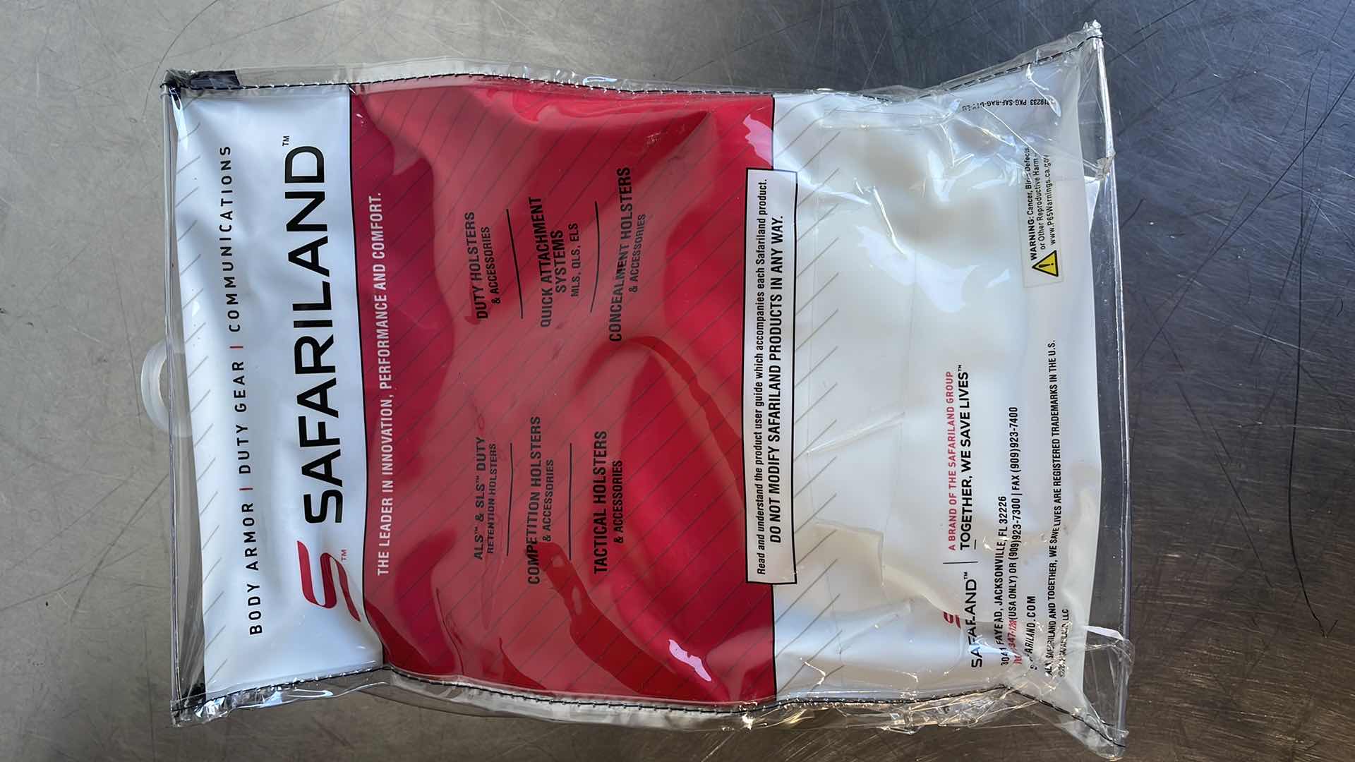 Photo 1 of SAFARILAND SMITH & WESSON M&P SHIELD 9MM 3.1" BBL MODEL: 5198 OPEN TOP PADDLE HOLSTER