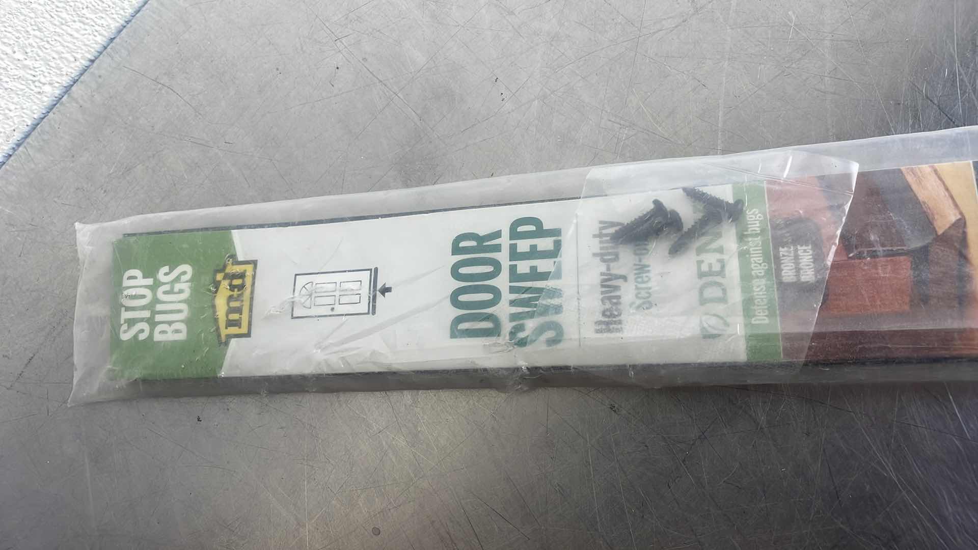 Photo 1 of 36 IN. BRONZE ALUMINUM AND VINYL HEAVY-DUTY DENY SCREW-ON DOOR SWEEP