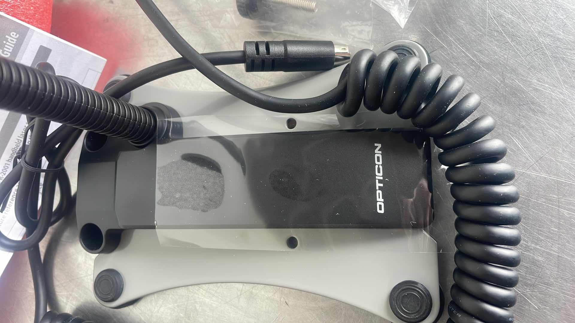 Photo 1 of OPTICON OPR 2001 - HANDHELD LASER SCANNER W/ STAND - KEYBOARD WEDGE
CONNECTION