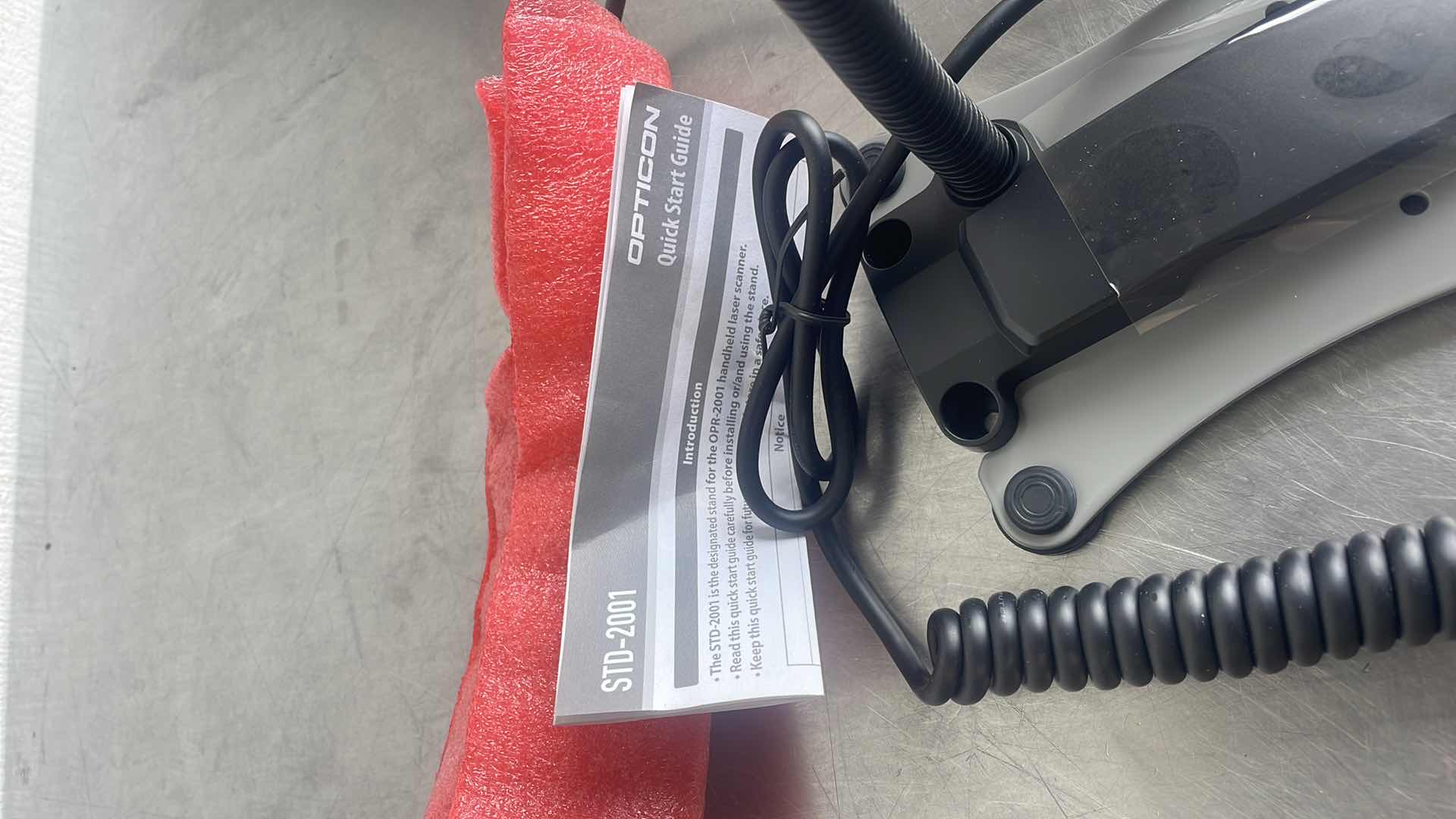 Photo 1 of OPTICON OPR 2001 - HANDHELD LASER SCANNER W/ STAND - KEYBOARD WEDGE
CONNECTION