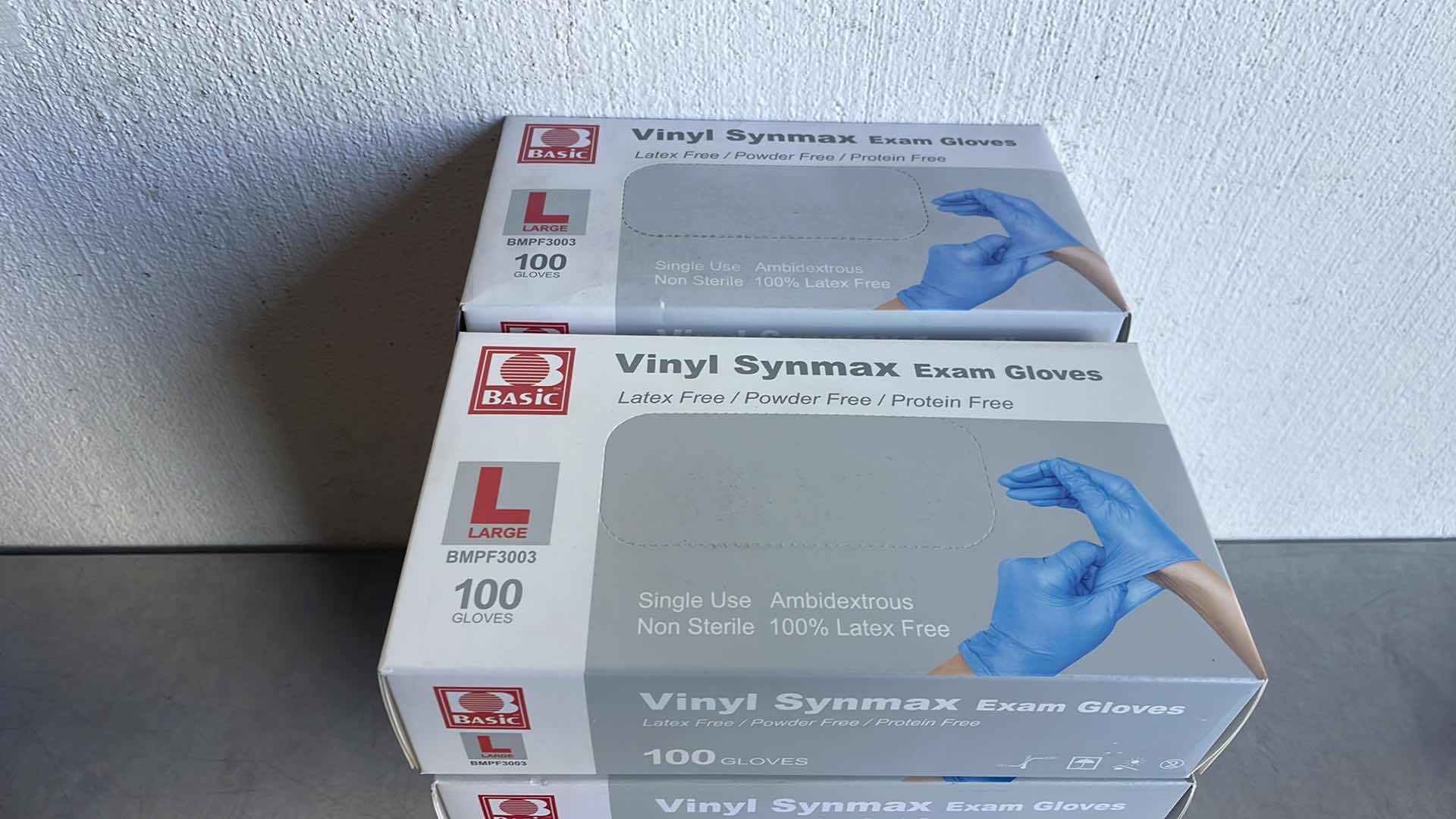 Photo 1 of BASIC LARGE VINYL SYNMAXEXAM GLOVES 10 BOXES OF 100