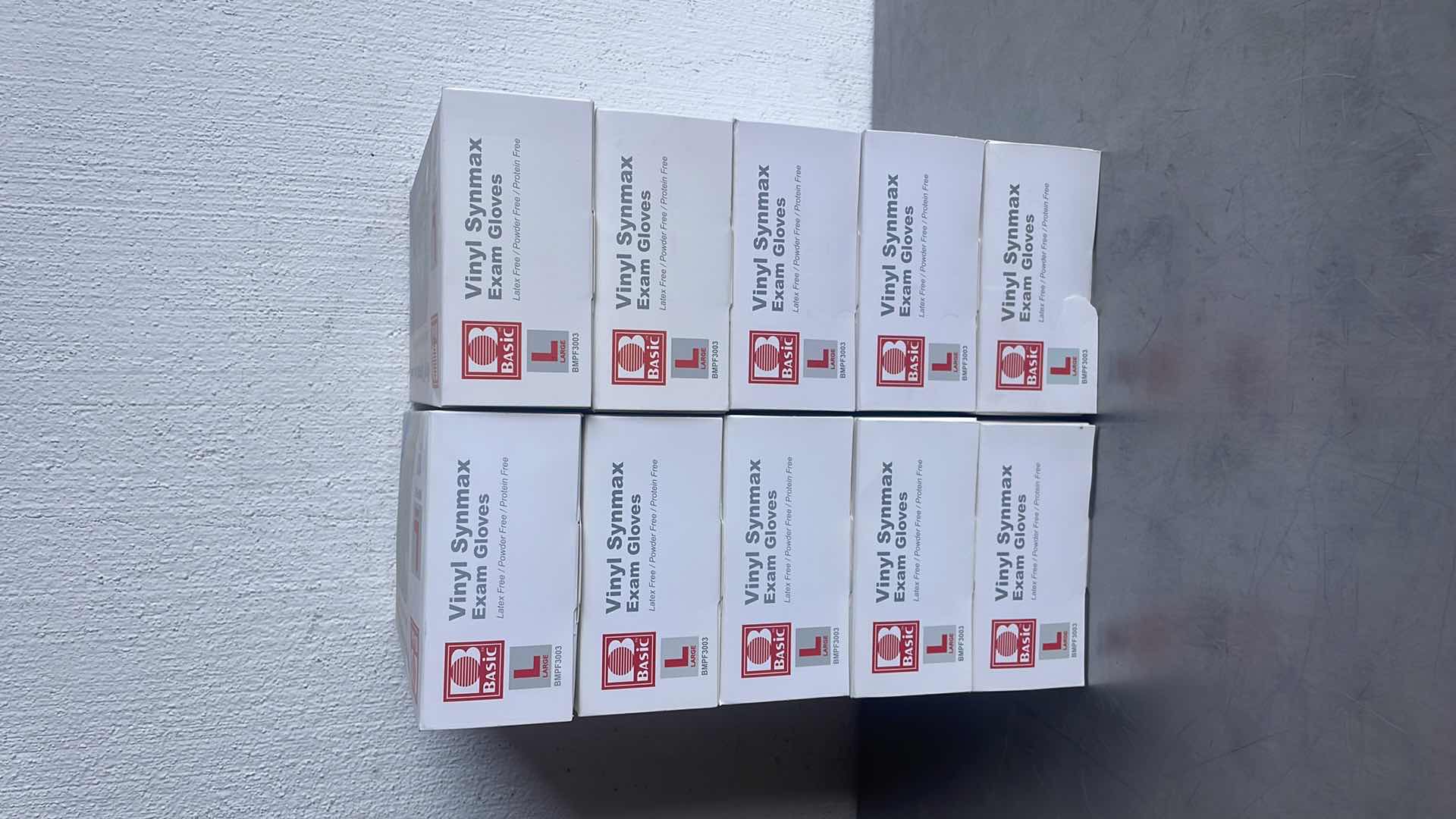Photo 1 of BASIC LARGE VINYL SYNMAXEXAM GLOVES 10 BOXES OF 100