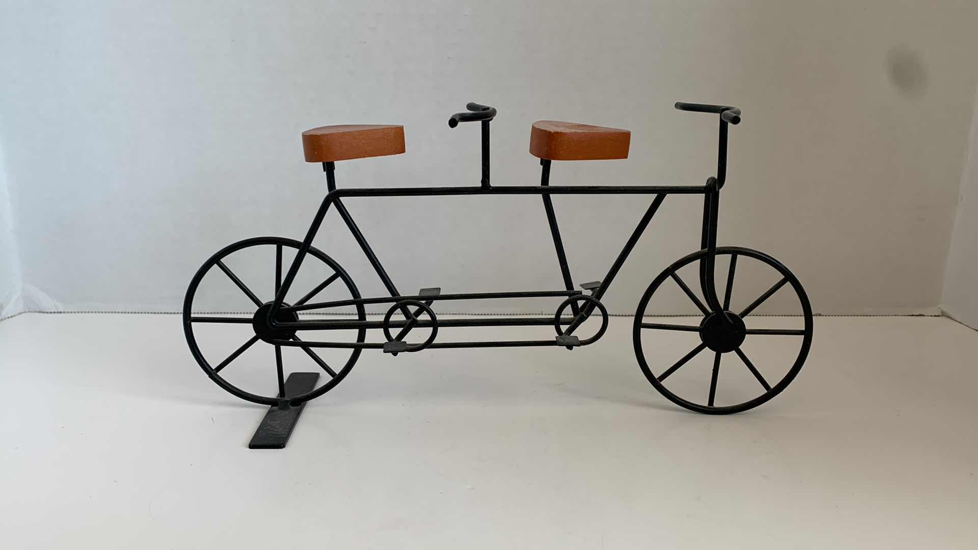 Photo 1 of SET OF 2 METAL BICYCLES WITH WOODEN SEATS TALLEST 5"