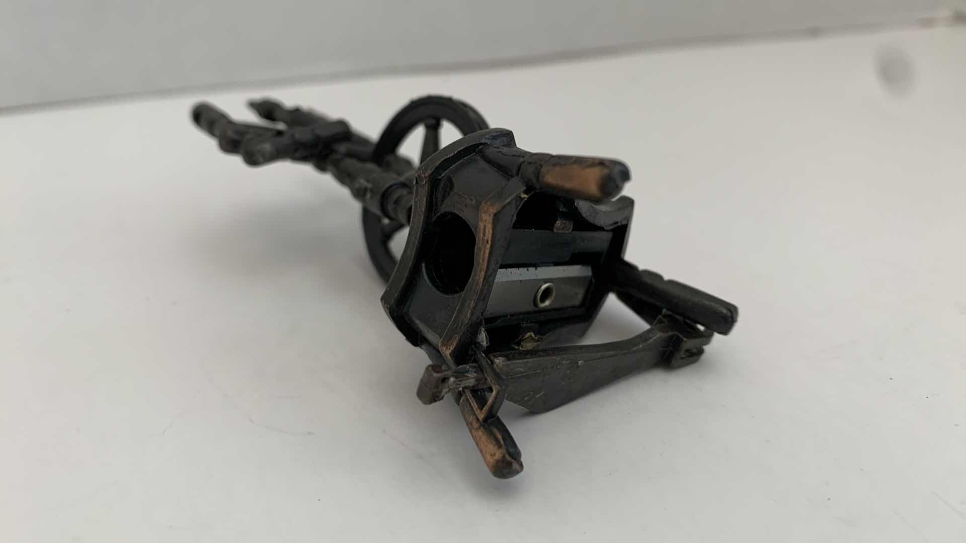 Photo 1 of SET OF 2 METAL STATUES: SPINNING WHEEL PENCIL SHARPENER AND CLOTHING MANGLE TALLEST 4"