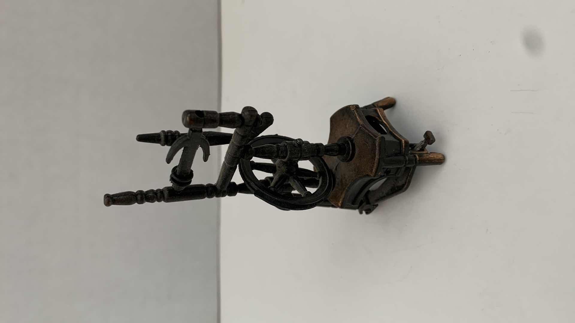 Photo 1 of SET OF 2 METAL STATUES: SPINNING WHEEL PENCIL SHARPENER AND CLOTHING MANGLE TALLEST 4"