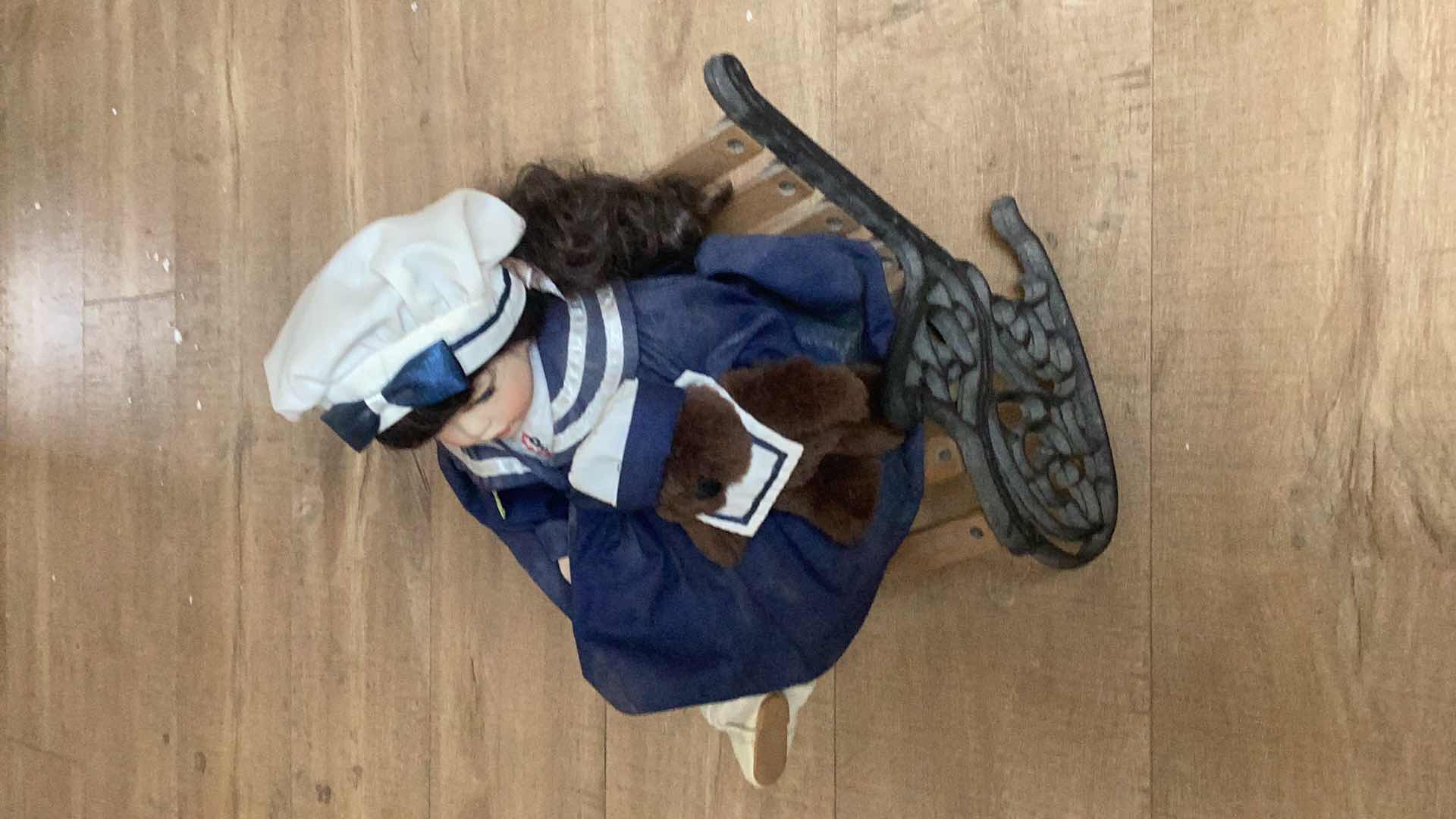 Photo 1 of DOLL IN A ROCKING CHAIR