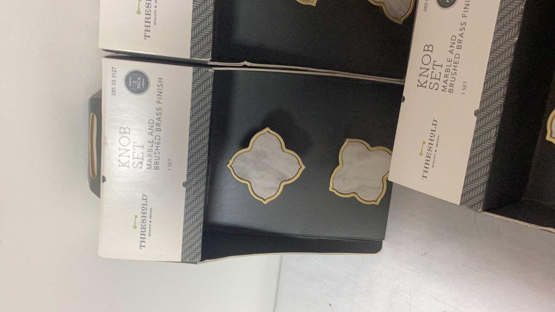 Photo 1 of FIVE THRESHOLD MARBLE AND BRUSHED BRASS KNOB SETS