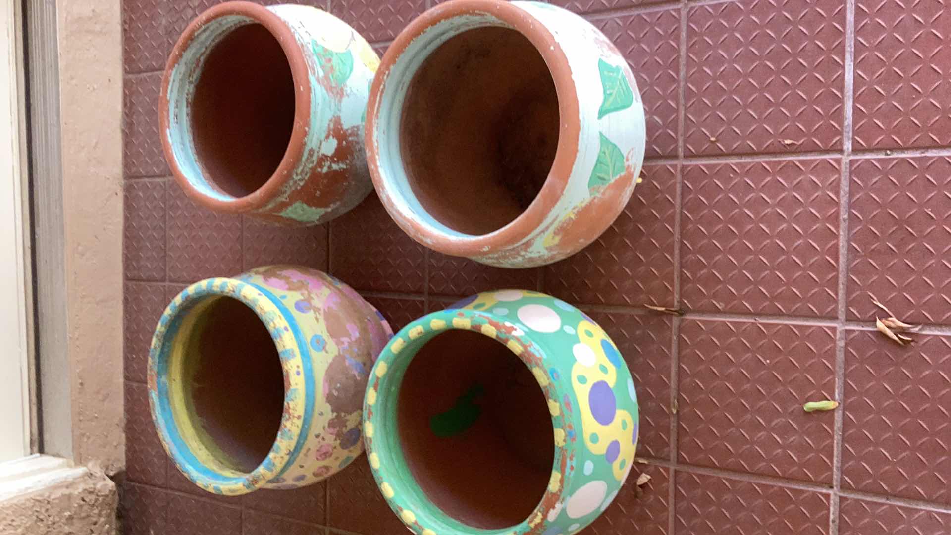 Photo 1 of FOUR TERRA COTTA PLANTERS TALLEST 9”