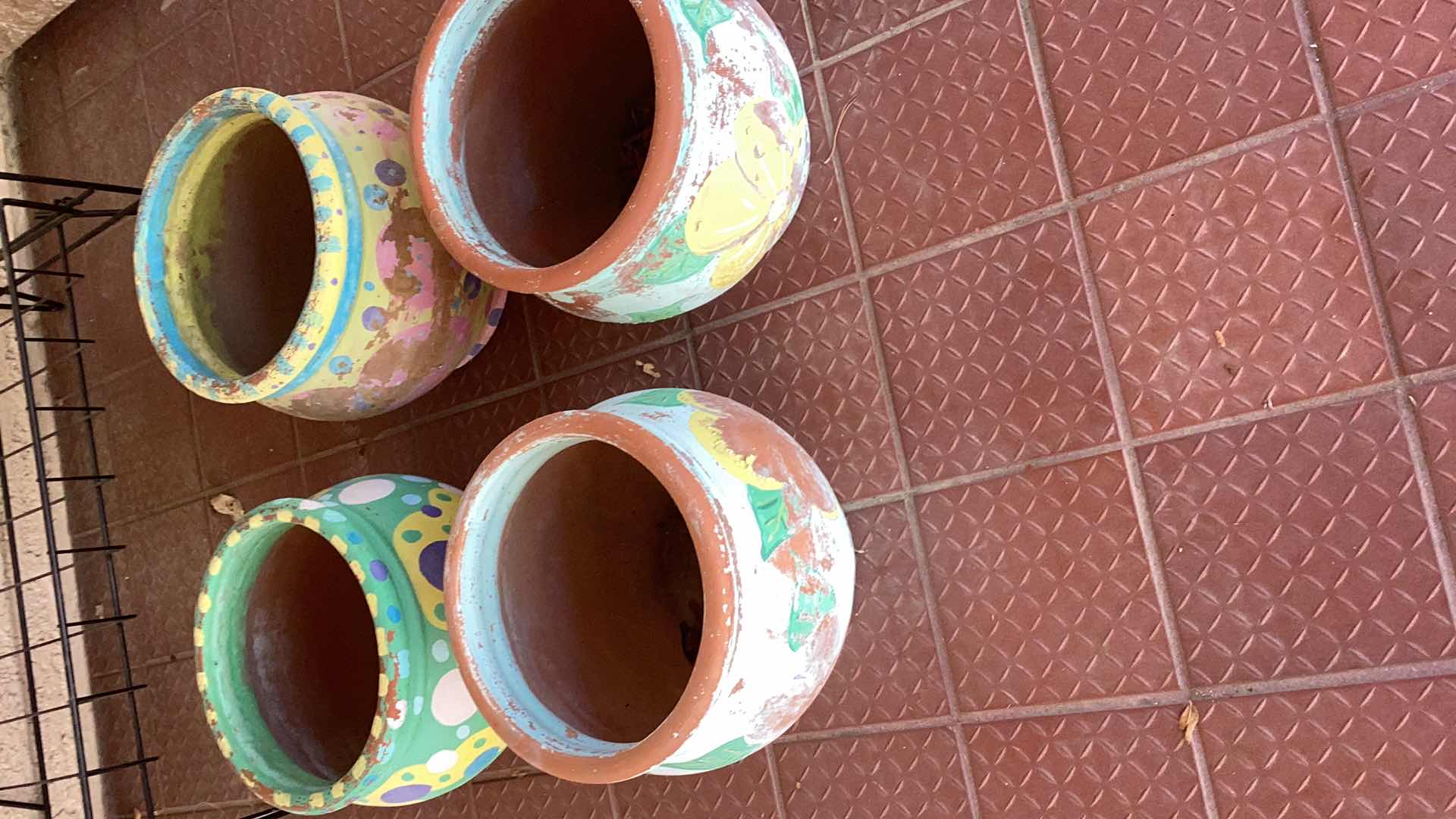 Photo 1 of FOUR TERRA COTTA PLANTERS TALLEST 9”