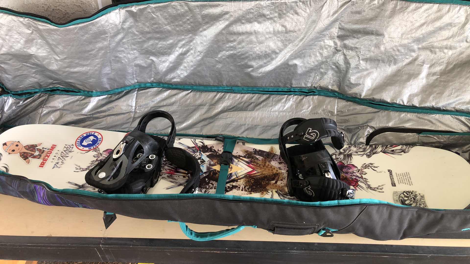 Photo 1 of THE SYSTEM ARBOR SNOWBOARD WITH CASE AND SIZE 7 BOOTS