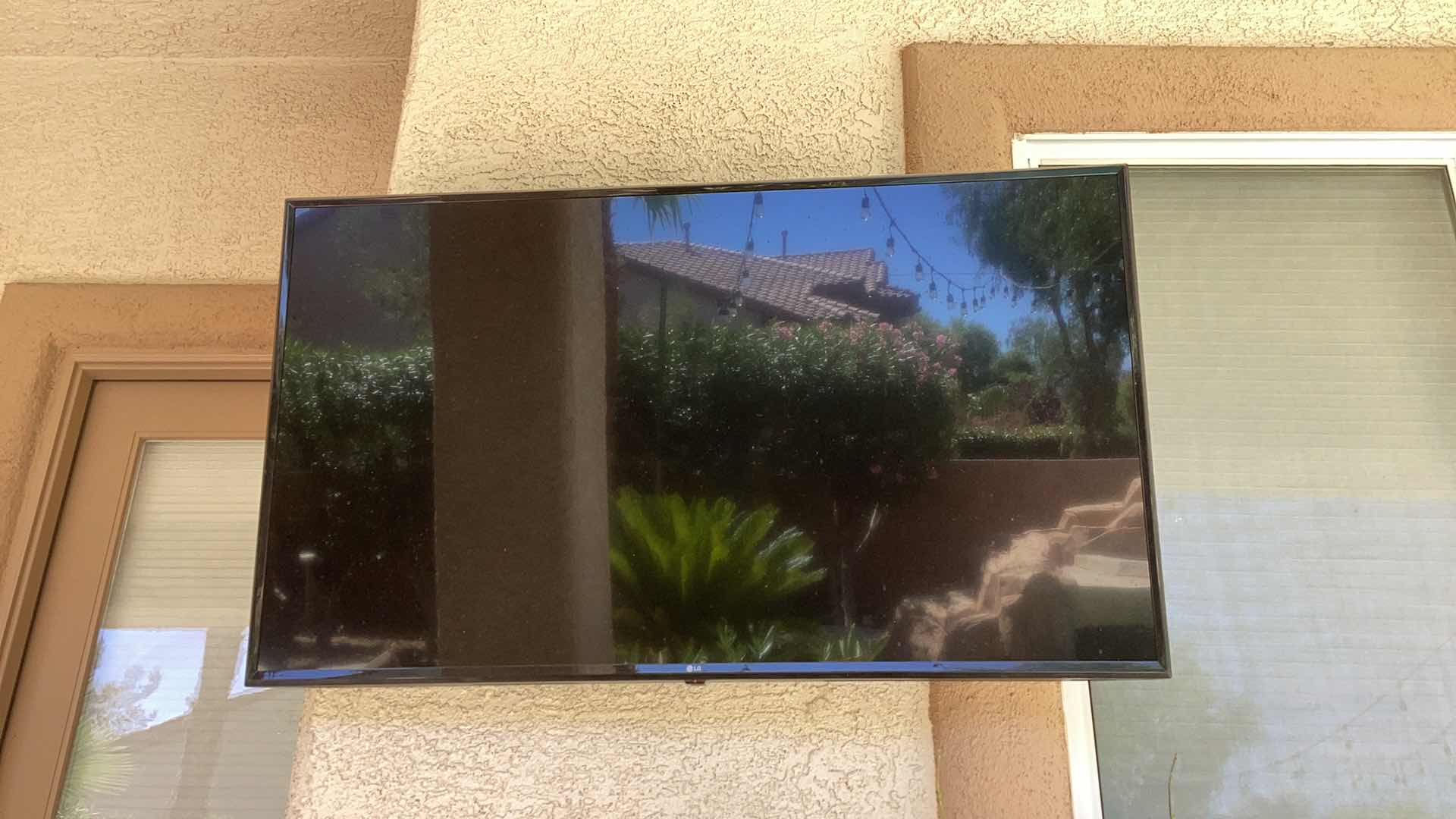 Photo 1 of LG 55" Class 4K UHD Smart LED TV W/ MOUNT 55UM6910PUC - BUYER TO REMOVE