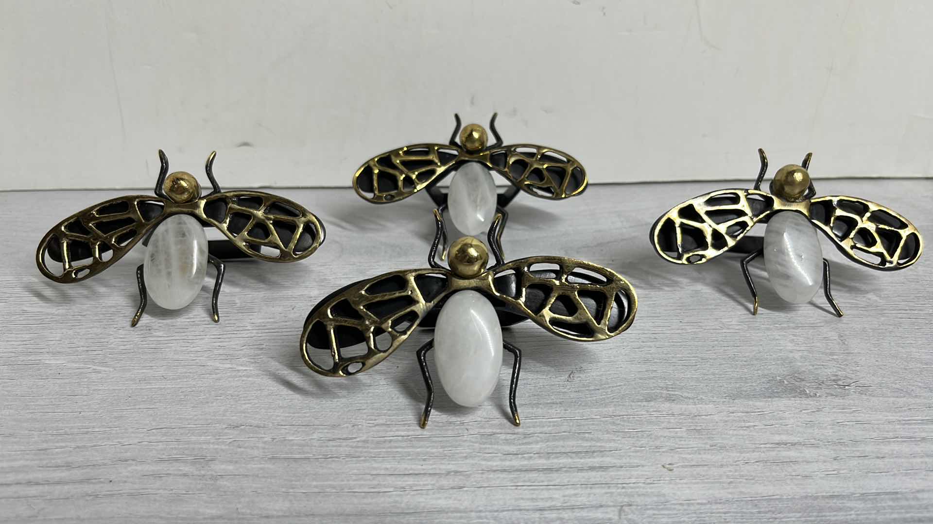 Photo 1 of KIM SEYBERT FLY AWAY BRASS NAPKIN RING W QUARTZ ABDOMEN 3” X 4” H2” (6)
