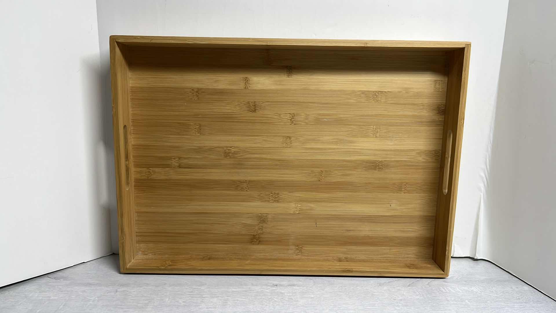 Photo 1 of BAMBOO SERVING TRAY W HANDLES 13.75” X 19.75” H2.25”