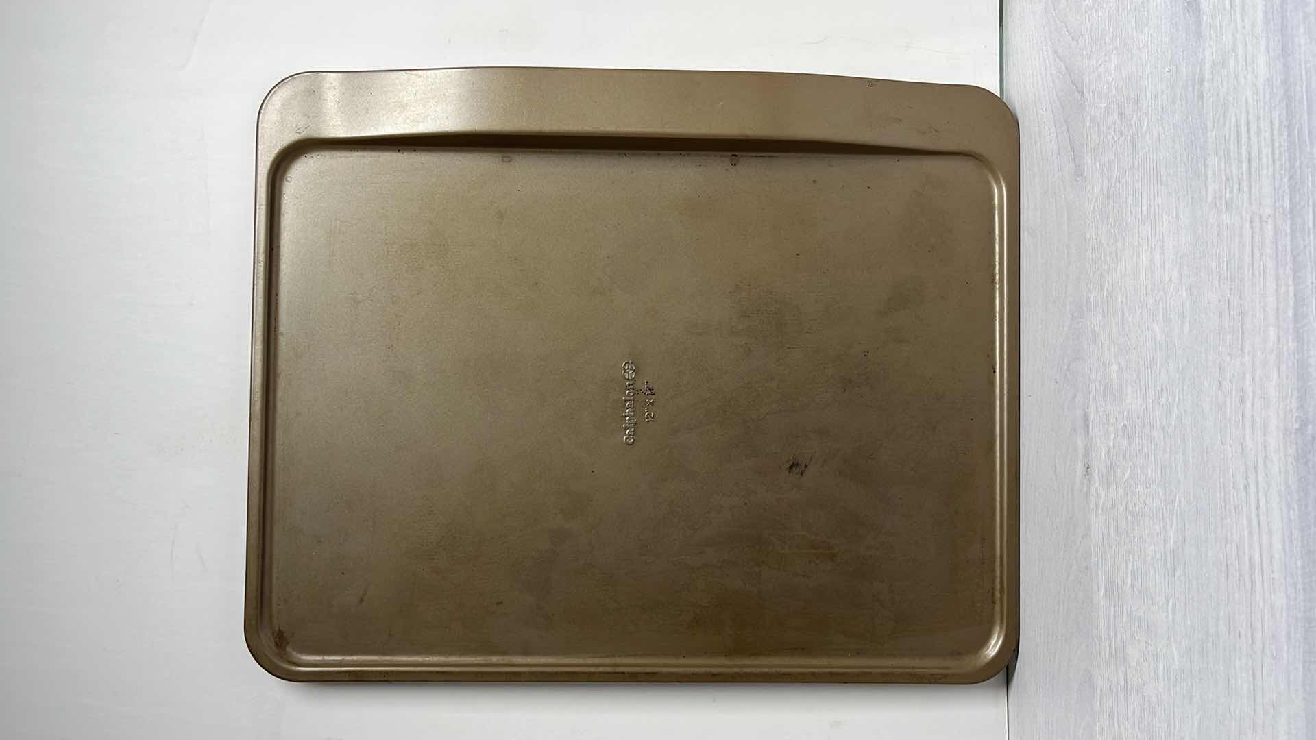 Photo 1 of CALPHALON 12” x 17” BAKING SHEET, 12 CAVITY MUFFIN PAN & 17” ROLLING PIN