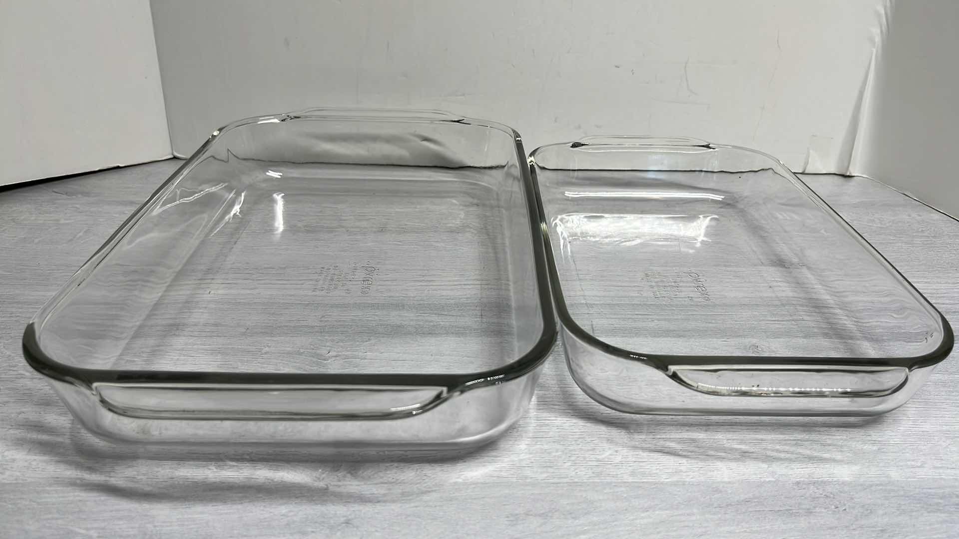 Photo 1 of PYREX CLEAR RECTANGULAR BAKING DISHES W HANDLES 2QT & 3QT (2)